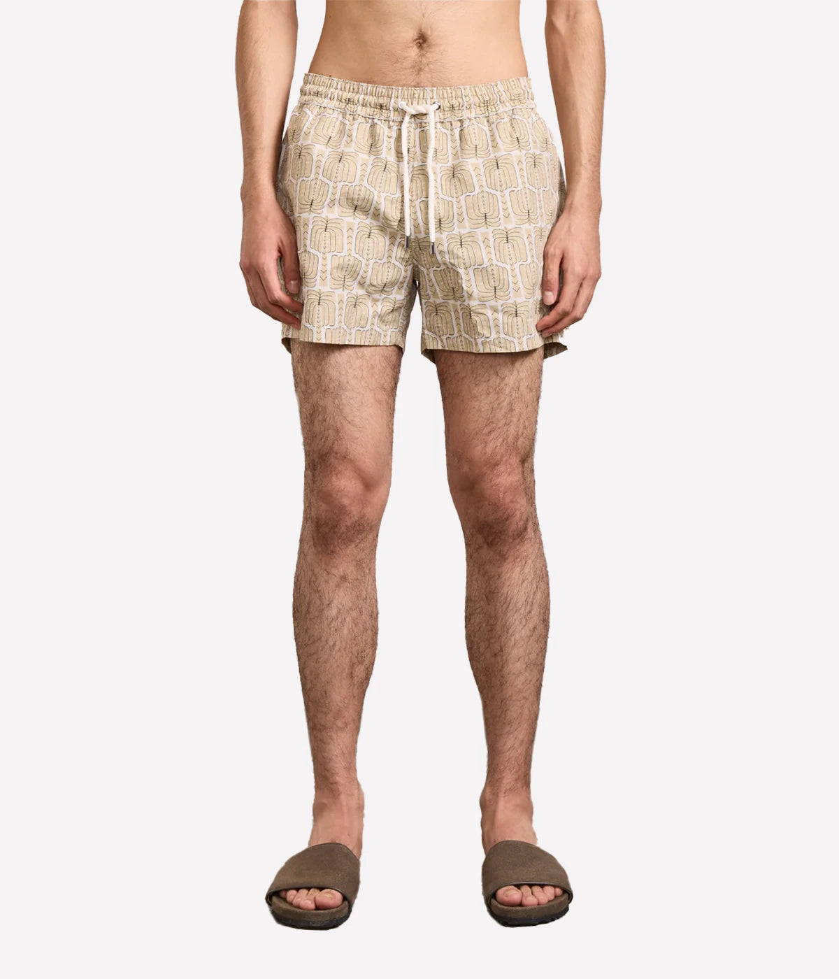 Rio Swim Shorts with drawstring waist, branded cord-ends, 100% recycled polyester mesh lining, and back pocket with button-closure. Quick-drying and sporty fit.