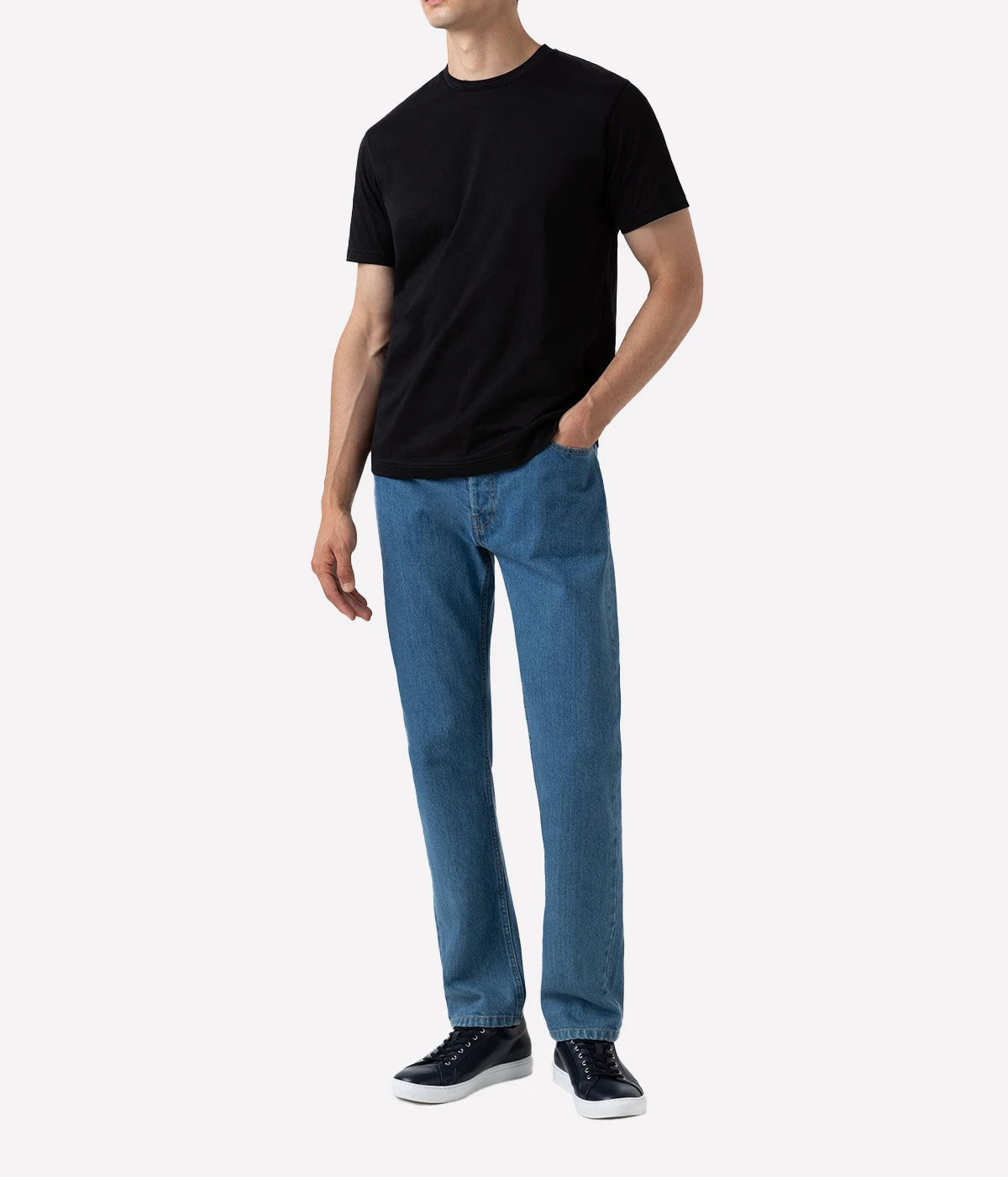 Model wearing the Sunspel Riviera T-Shirt, featuring a tailored fit and a classic crew neck. Made from luxurious midweight cotton, the shirt offers a smooth, durable feel and effortless style for any occasion.