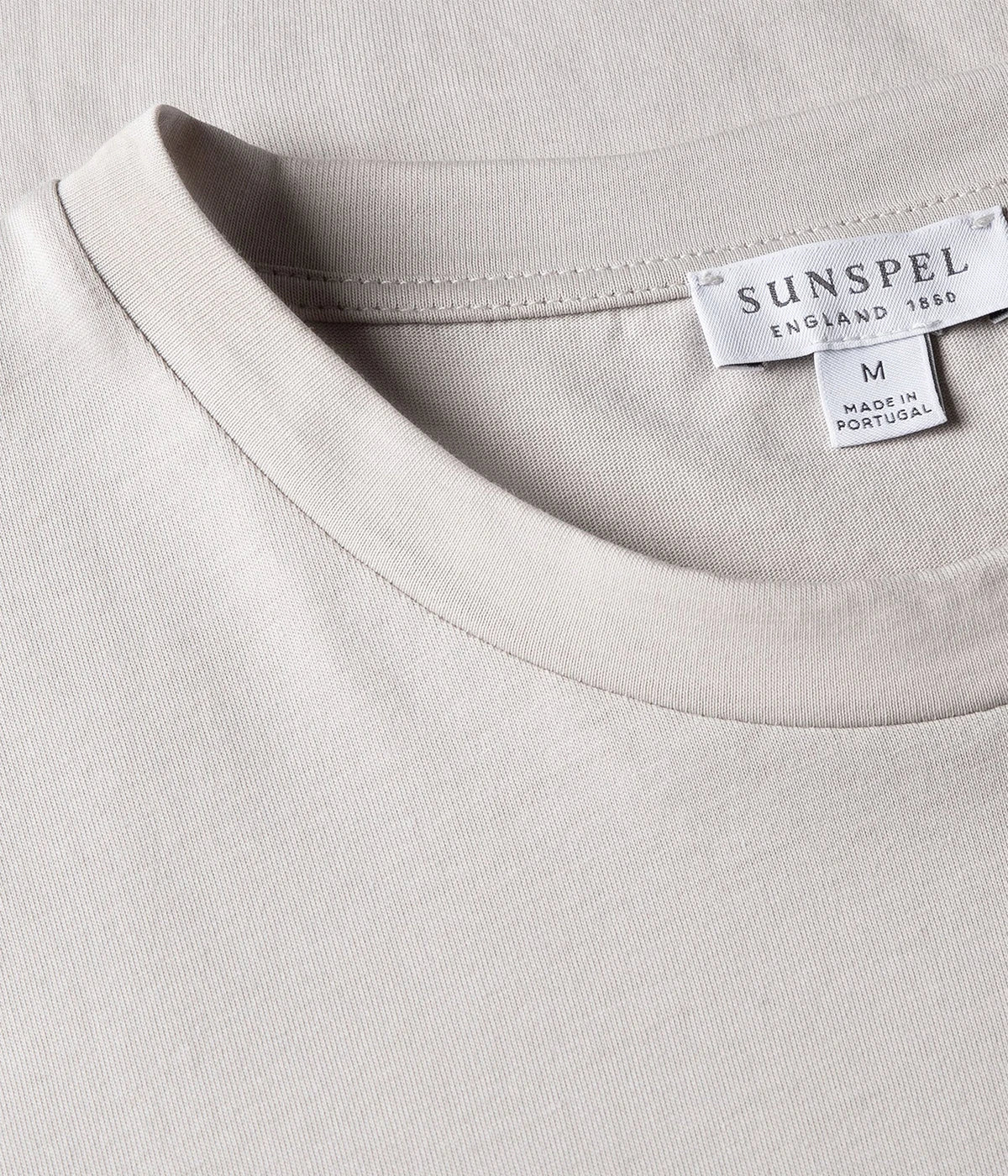 Close-up of the Sunspel Riviera T-Shirt fabric, highlighting the luxurious midweight cotton. The smooth texture and slight extra weight make it durable and perfect for transitioning between seasons.