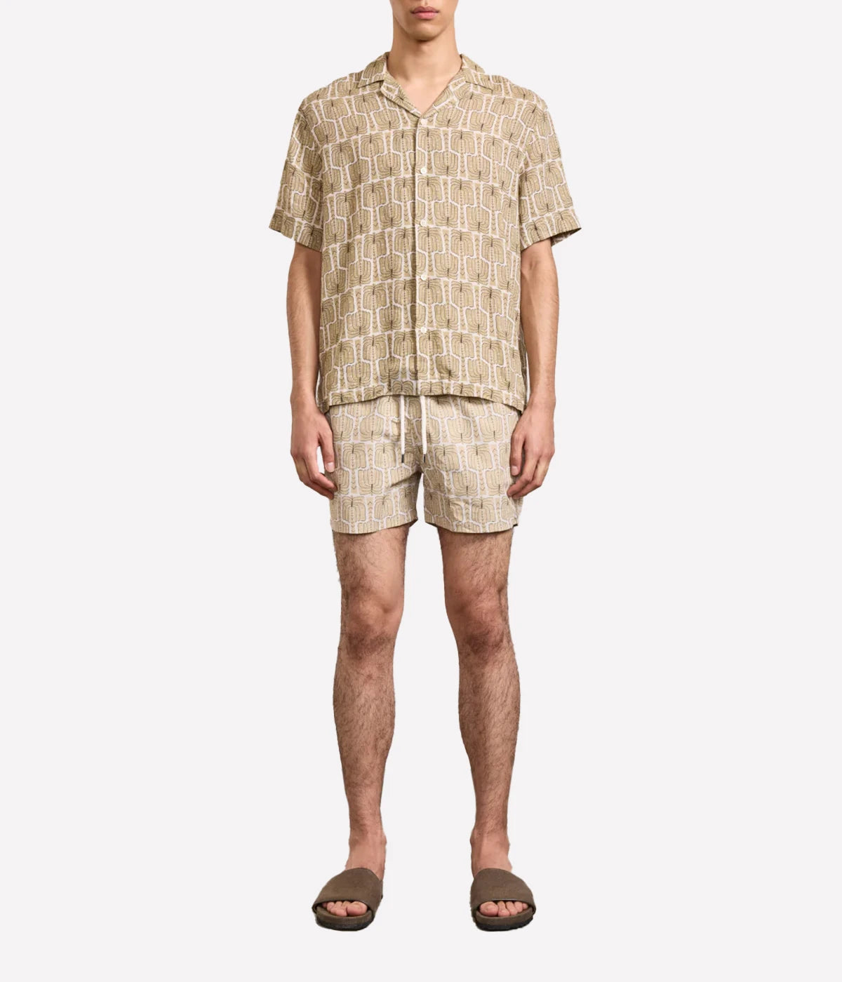 Roberto linen shirt with camp collar, imitation mother-of-pearl branded buttons, relaxed fit, and all-over custom Palmeira print inspired by Rio.