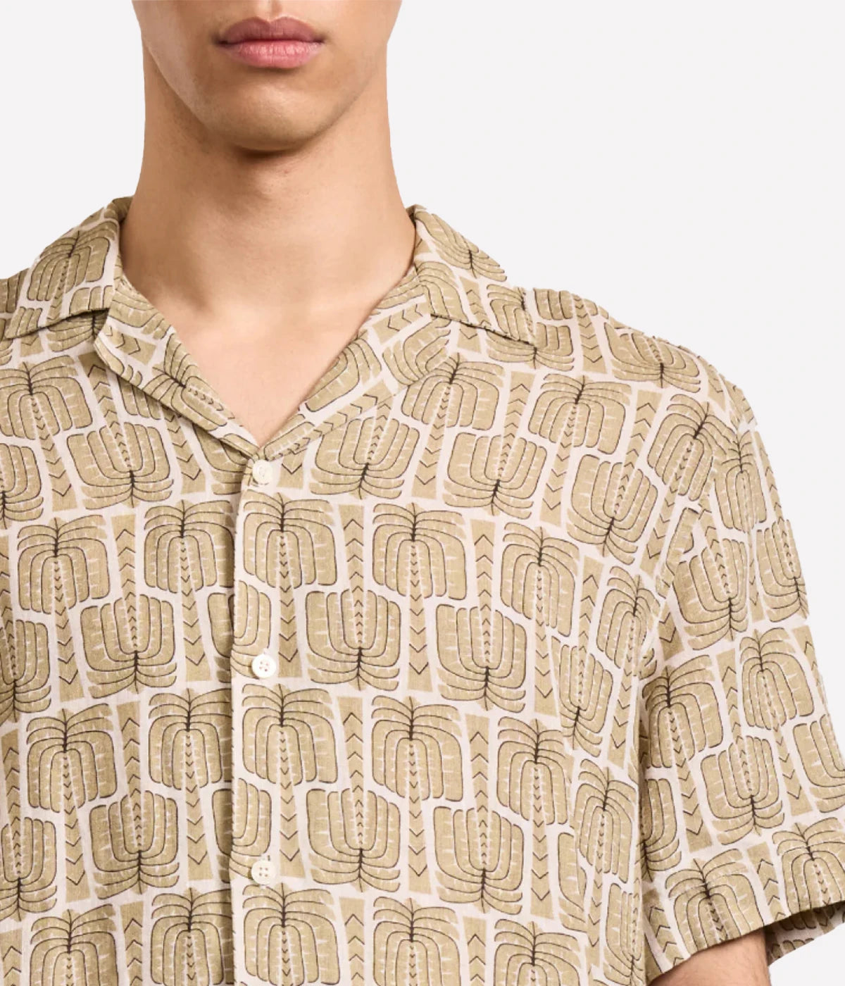 Roberto linen shirt with camp collar, imitation mother-of-pearl branded buttons, relaxed fit, and all-over custom Palmeira print inspired by Rio.