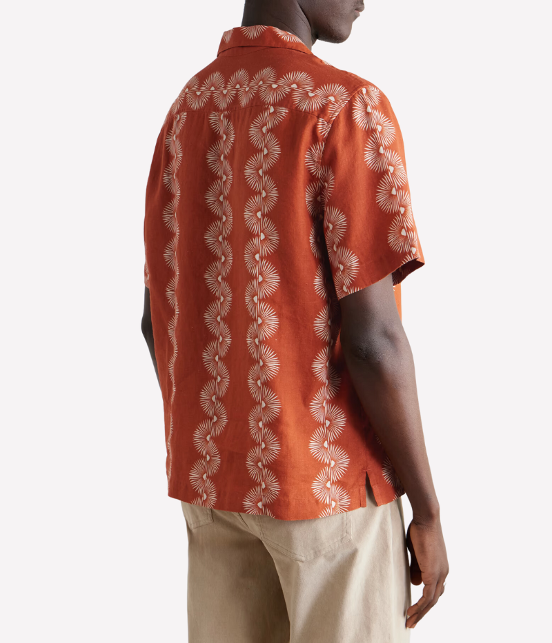 The Roberto Linen Short Sleeve Geo Shirt in Burnt Orange features a modern geometric pattern and lightweight linen fabric. With a relaxed fit and short sleeves, this shirt is perfect for warm weather, offering breathability and versatility for casual or dressier occasions. Style with tailored shorts or chinos for a refined summer look.