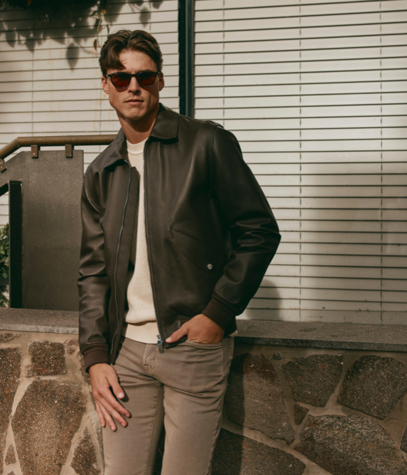 Two-tone nappa leather flight jacket with ribbed trims, flap pockets, and a two-way zipper, made in Italy.