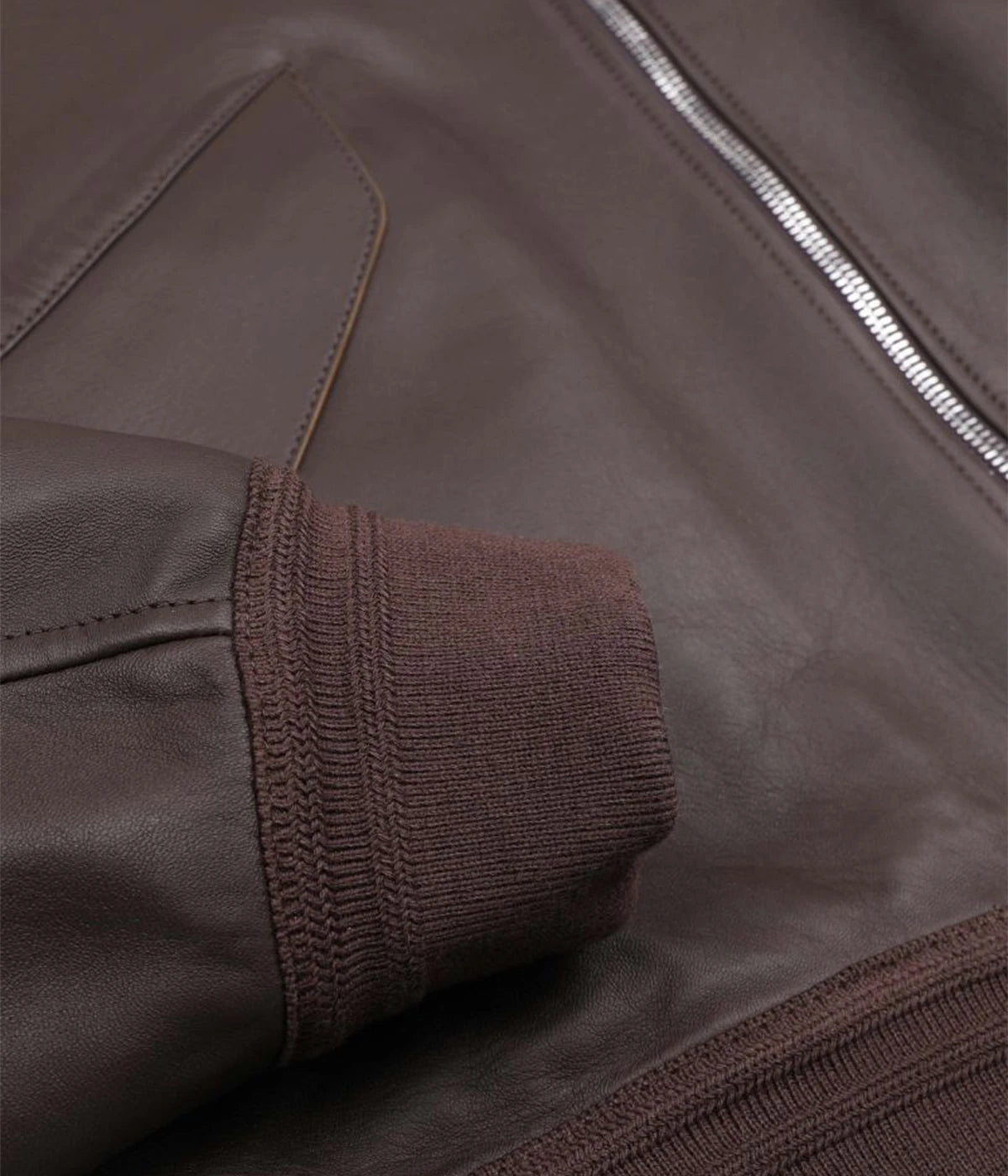 Two-tone nappa leather flight jacket with ribbed trims, flap pockets, and a two-way zipper, made in Italy.