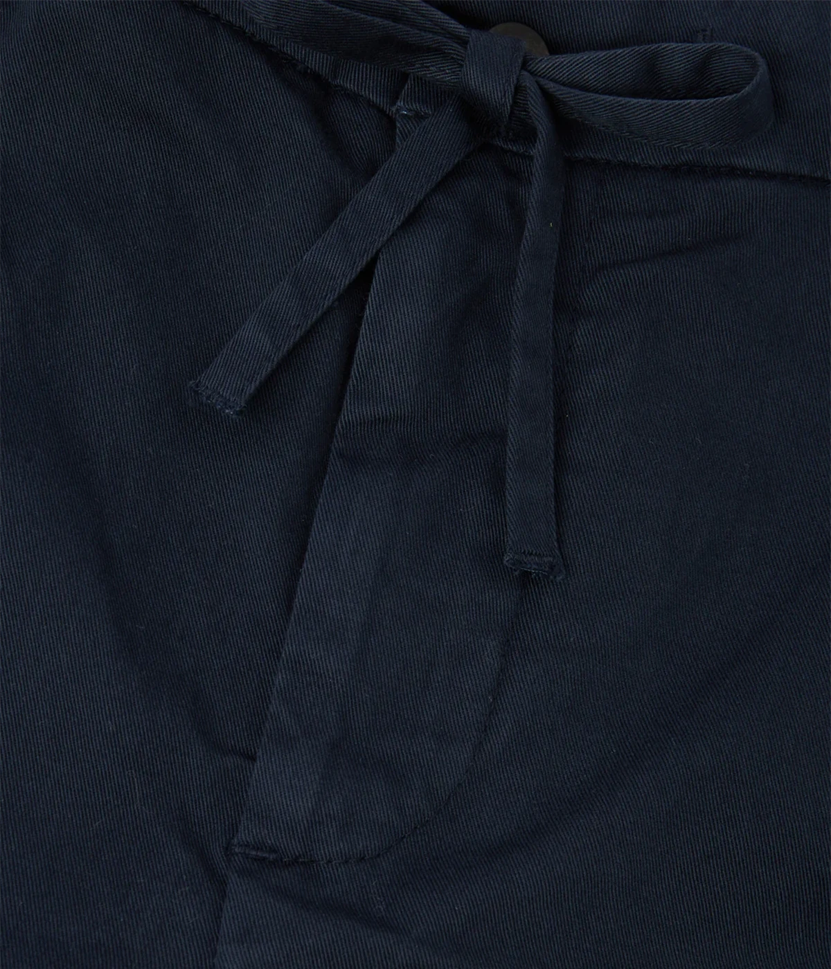 Straight-leg shorts in heavyweight cotton with pressed pleat detailing, featuring a partially elasticated waistband with adjustable drawstring, front button fastening, zip fly, side pockets, and back jetted pockets with buttons.