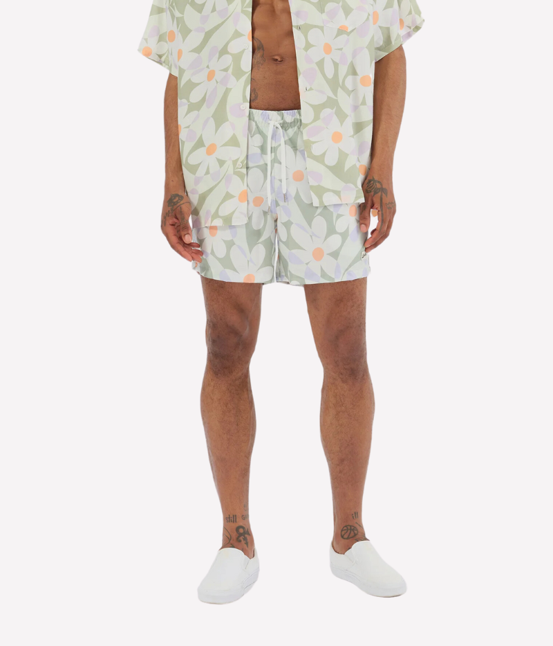 A playful statement for your swim style, the Bather Sage Daisy Trip Swim Trunk features a charming pattern of painted daisies in a calming sage hue. Designed for both fun and function, these trunks bring a laid-back vibe to any beach day or poolside hangout. Made for comfort and style, they’re perfect for making a splash, no matter where your adventures take you.