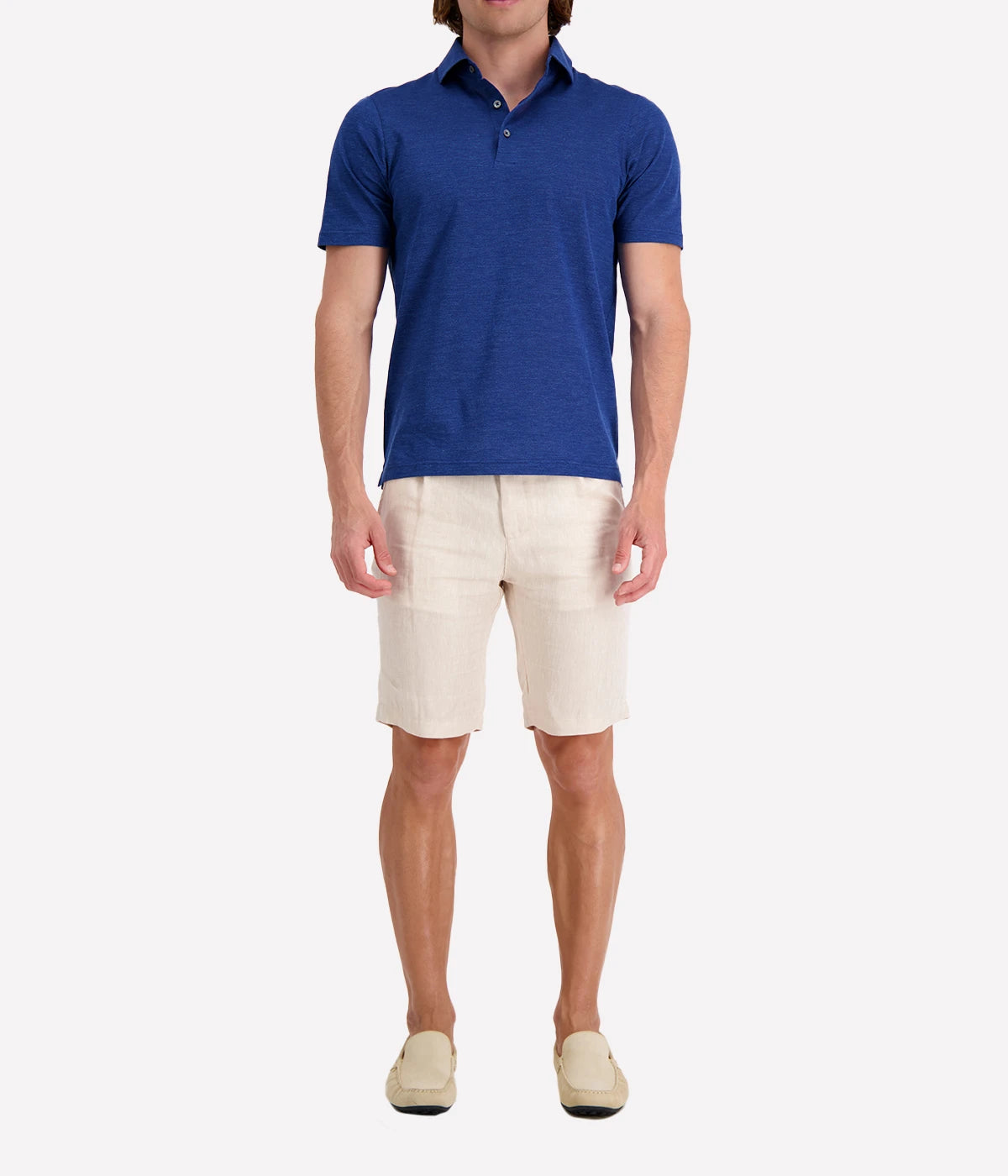 Model wearing the Gran Sasso Marine Blue Polo Shirt, styled with tailored shorts and loafers for a polished smart-casual look. A versatile Italian men’s shirt for any occasion.