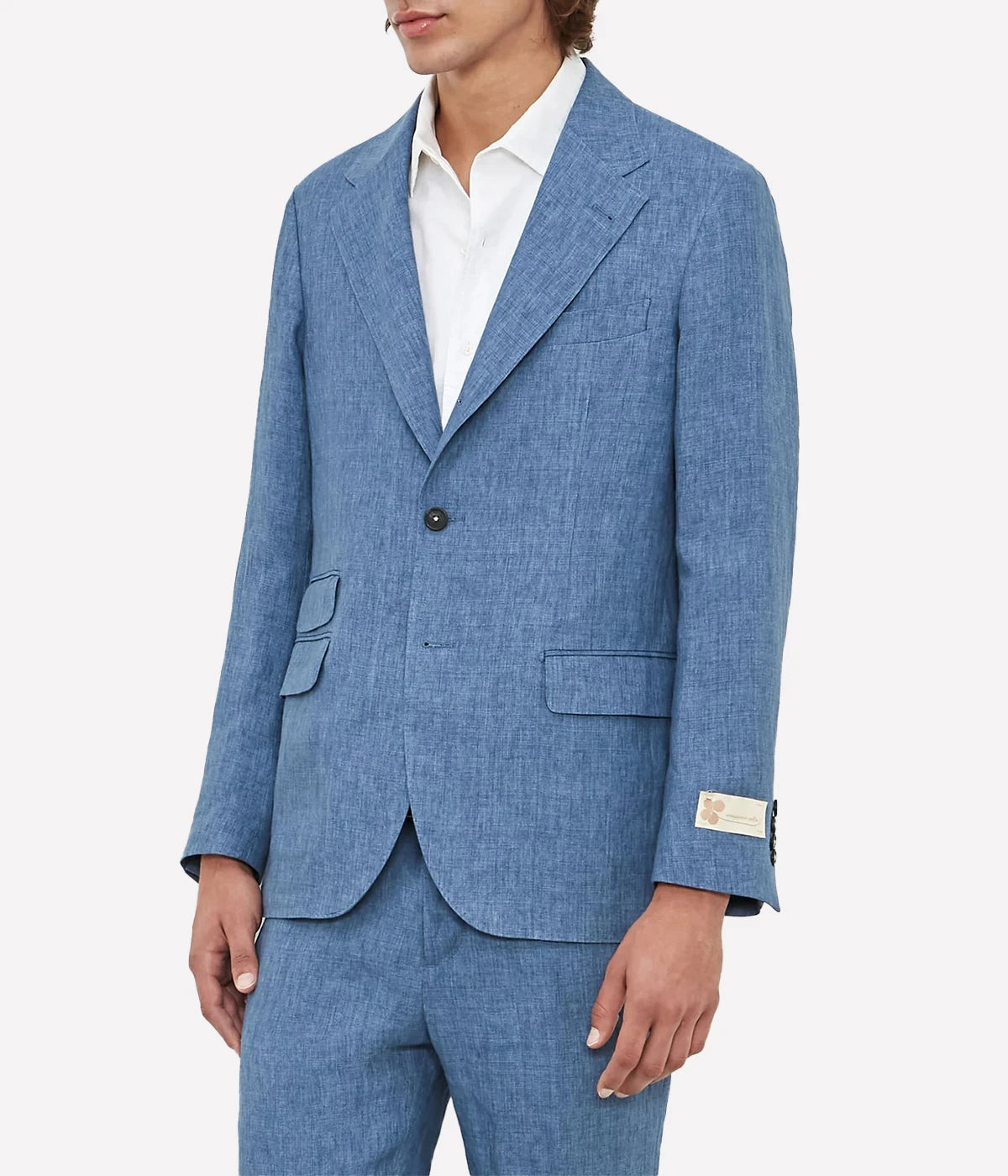 Men's casual deconstructed linen suit with a three-button jacket and slim-fit trousers.