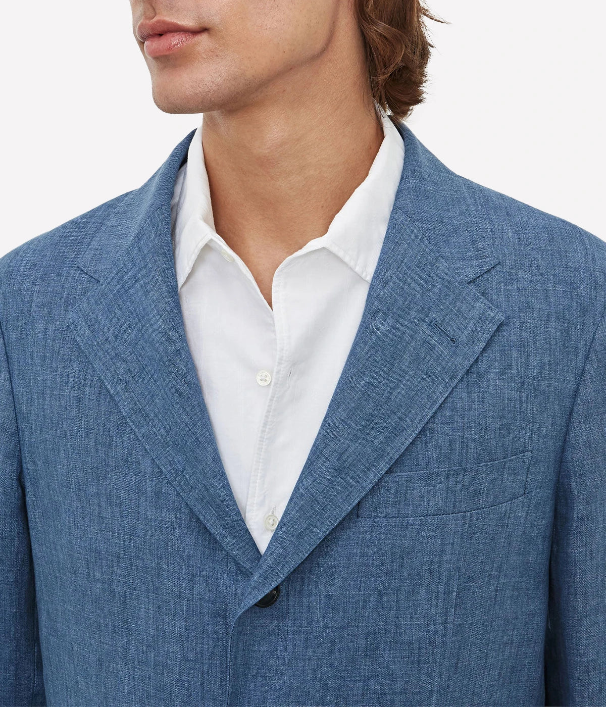 Men's casual deconstructed linen suit with a three-button jacket and slim-fit trousers.