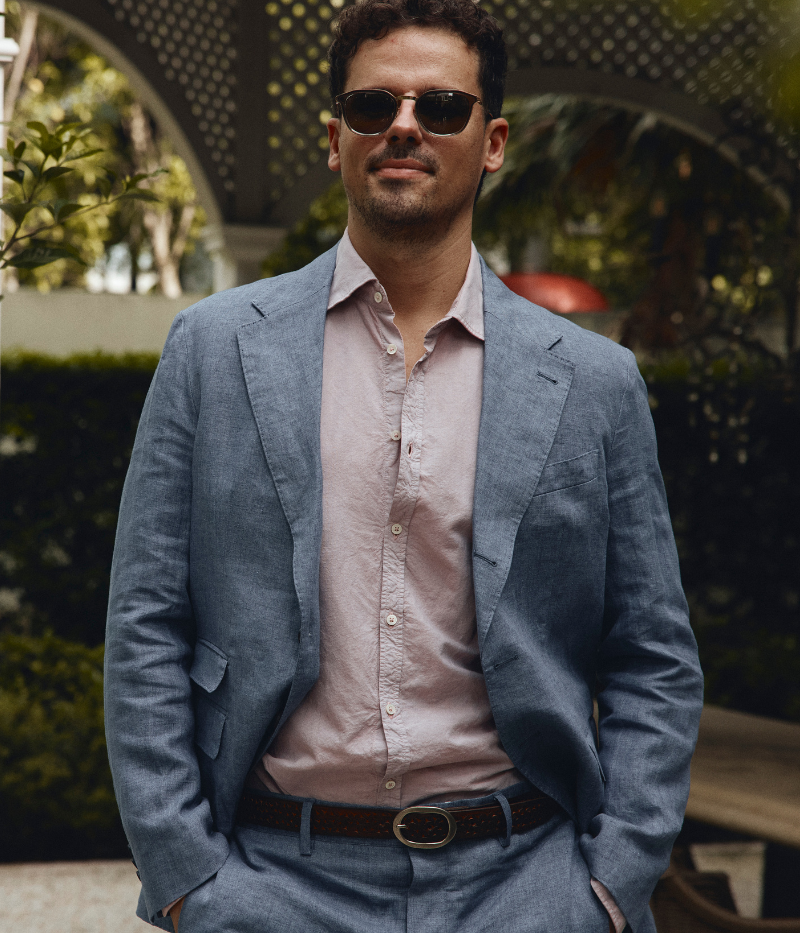 Men's casual deconstructed linen suit with a three-button jacket and slim-fit trousers.