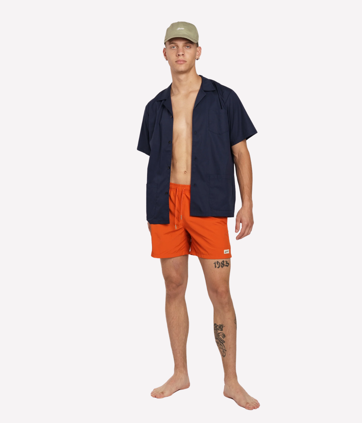 Orange Bather swim trunk for men featuring quick-dry recycled nylon, elastic waist, 5.5-inch inseam, mesh lining, and side pockets – luxury men’s swimwear Canada.