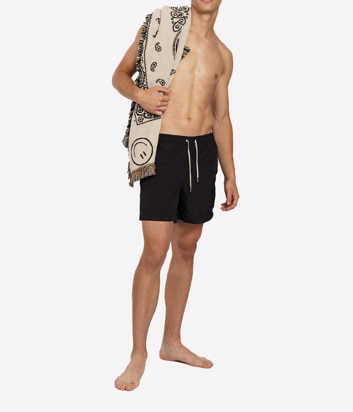 Model wearing Bather solid swim trunks, highlighting the tailored fit and casual design. The quick-dry fabric and stretch mesh lining make these trunks ideal for swimming, lounging, or outdoor activities.