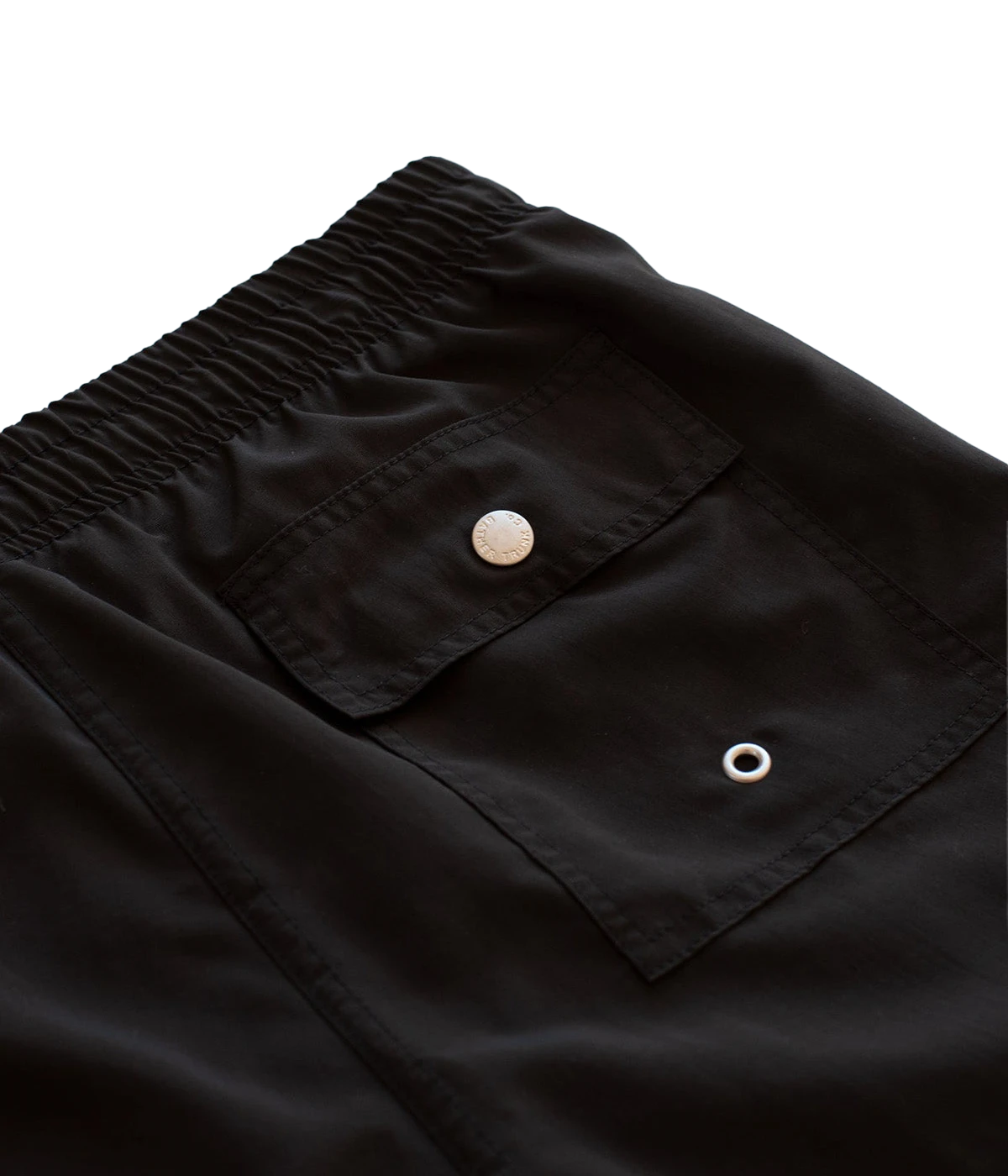 Close-up of Bather swim trunks’ fabric, showcasing the smooth, quick-dry 100% recycled polyester material. The ultra-fine mesh lining offers a soft, barely-there feel with four-way stretch for optimal mobility.