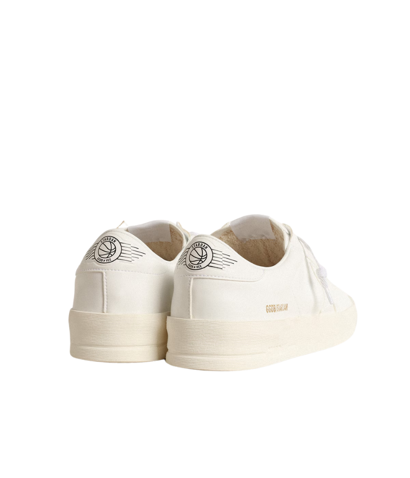 White Golden Goose Stardan sneakers in 100% cowhide leather, featuring a retro 90s basketball-inspired design. Minimalist all-white finish for a versatile, everyday look. Made in Italy.