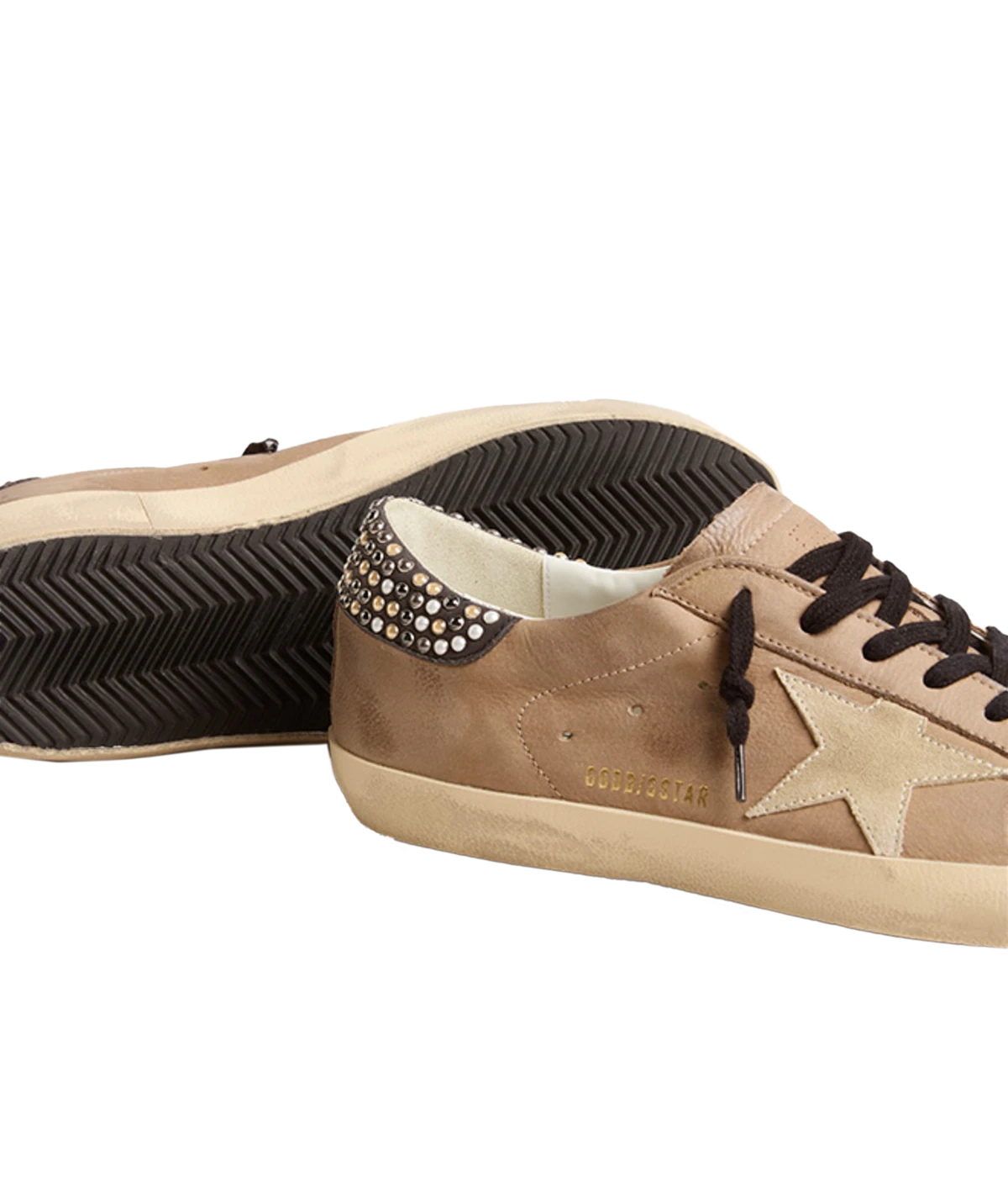 Iconic Golden Goose sneakers in premium cow leather, featuring pearl studs, a suede star detail, and a distressed rubber sole for a chic, vintage-inspired look.