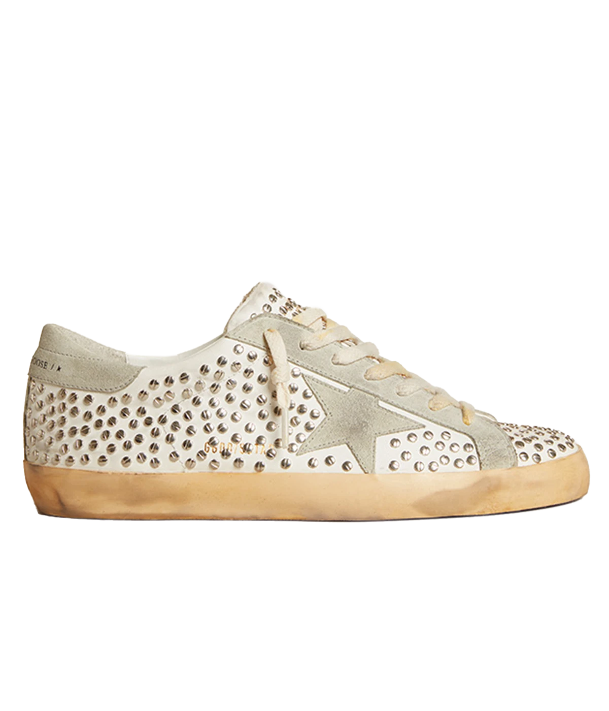 The Golden Goose Super Star Sneakers feature a suede star and are designed with the brand’s signature distressed detailing, complemented by all-over flat studs. Embossed logo lettering on the outer side of the right shoe adds a unique touch. With a rubber sole and round toe, these sneakers offer a stylish yet comfortable fit, making them the perfect addition to elevate casual looks with an edgy, luxurious twist.
