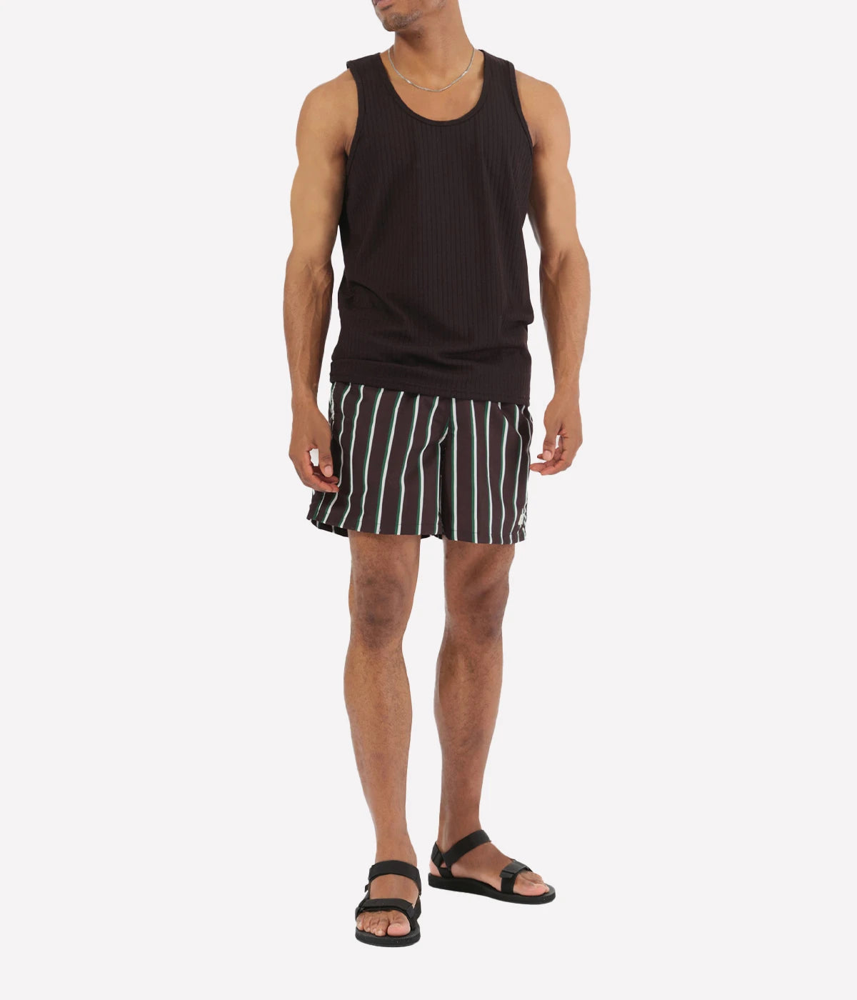 Model wearing Bather solid swim trunks, highlighting the tailored fit and casual design. The quick-dry fabric and stretch mesh lining make these trunks ideal for swimming, lounging, or outdoor activities.