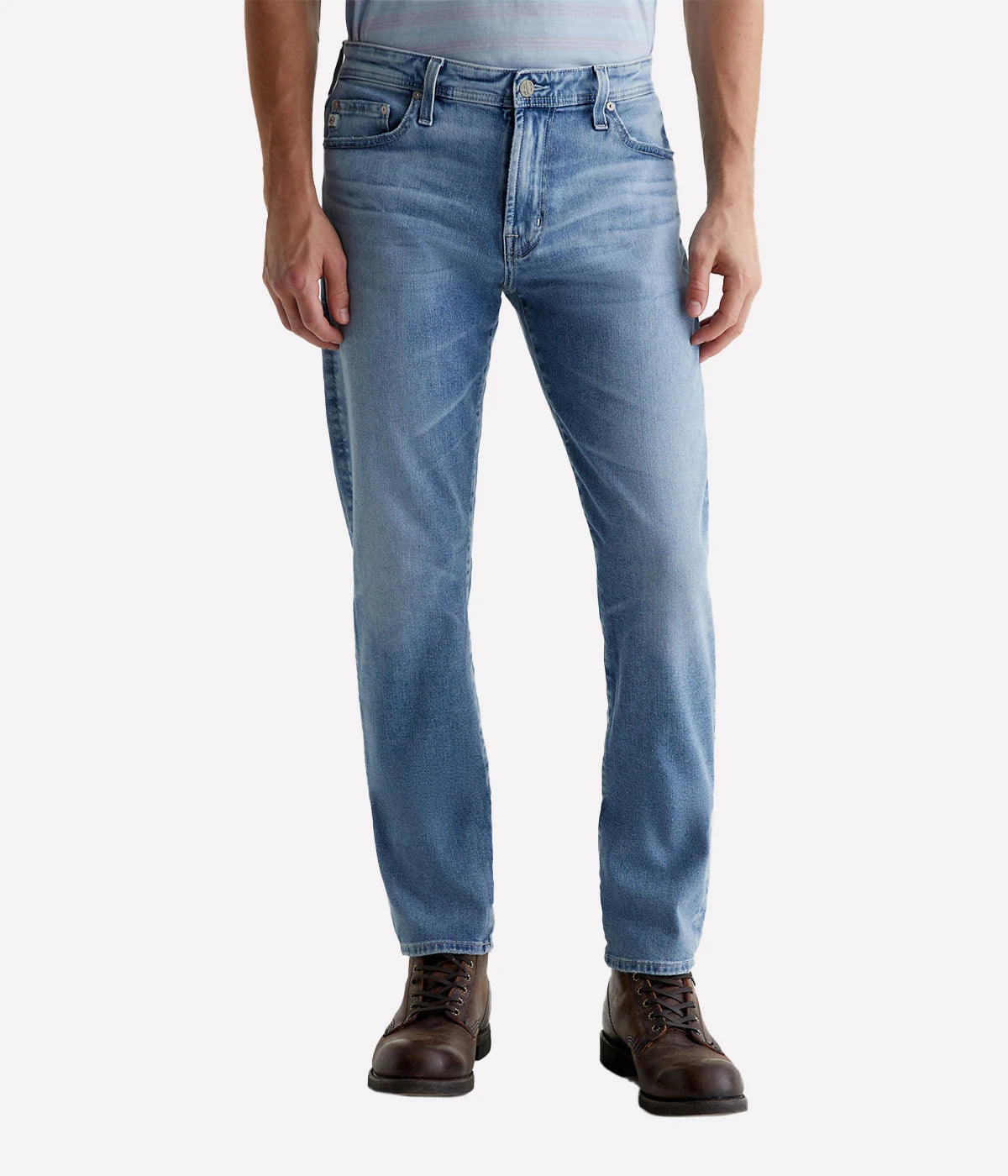 Tellis Modern Slim Jean for men in a light blue wash with fading, whiskering, and worn edges for a vintage AG-ed™ look that emulates 19 years of wear. Featuring a fitted upper block and tapered leg opening for a tailored, sleek silhouette.
