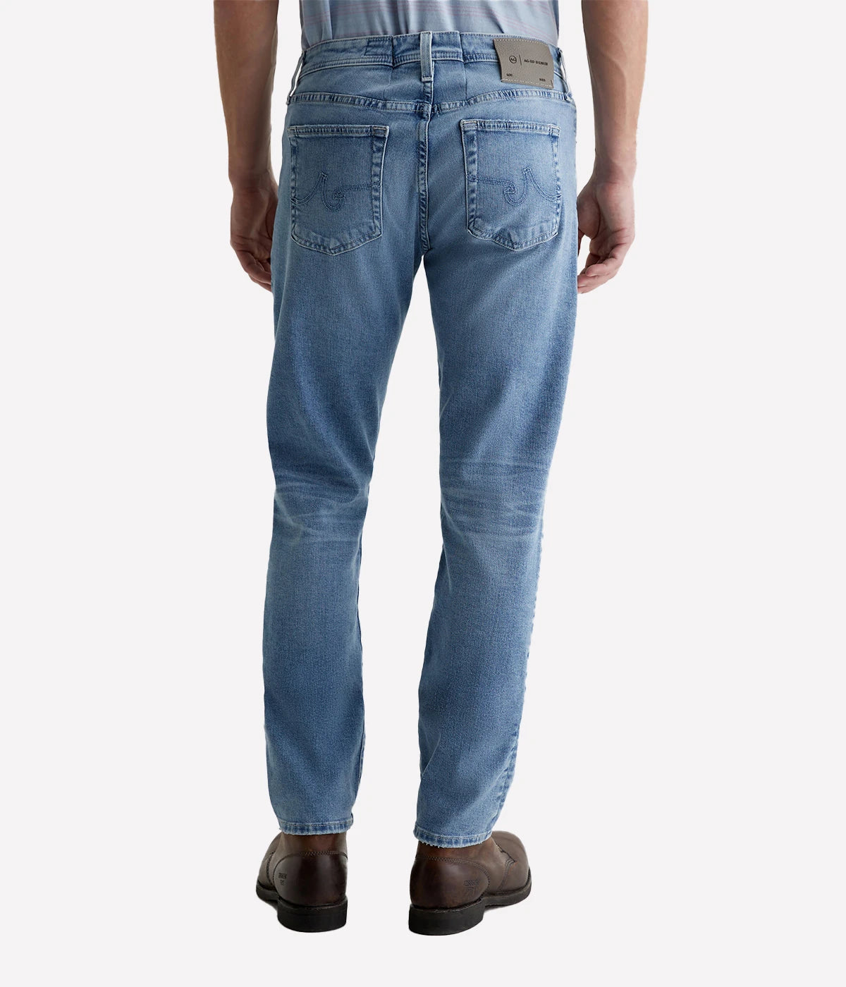 Back view of the Tellis Modern Slim Jean, highlighting the clean, slim silhouette and distressed details for a well-worn, authentic look. Designed for comfort and style with every wear.