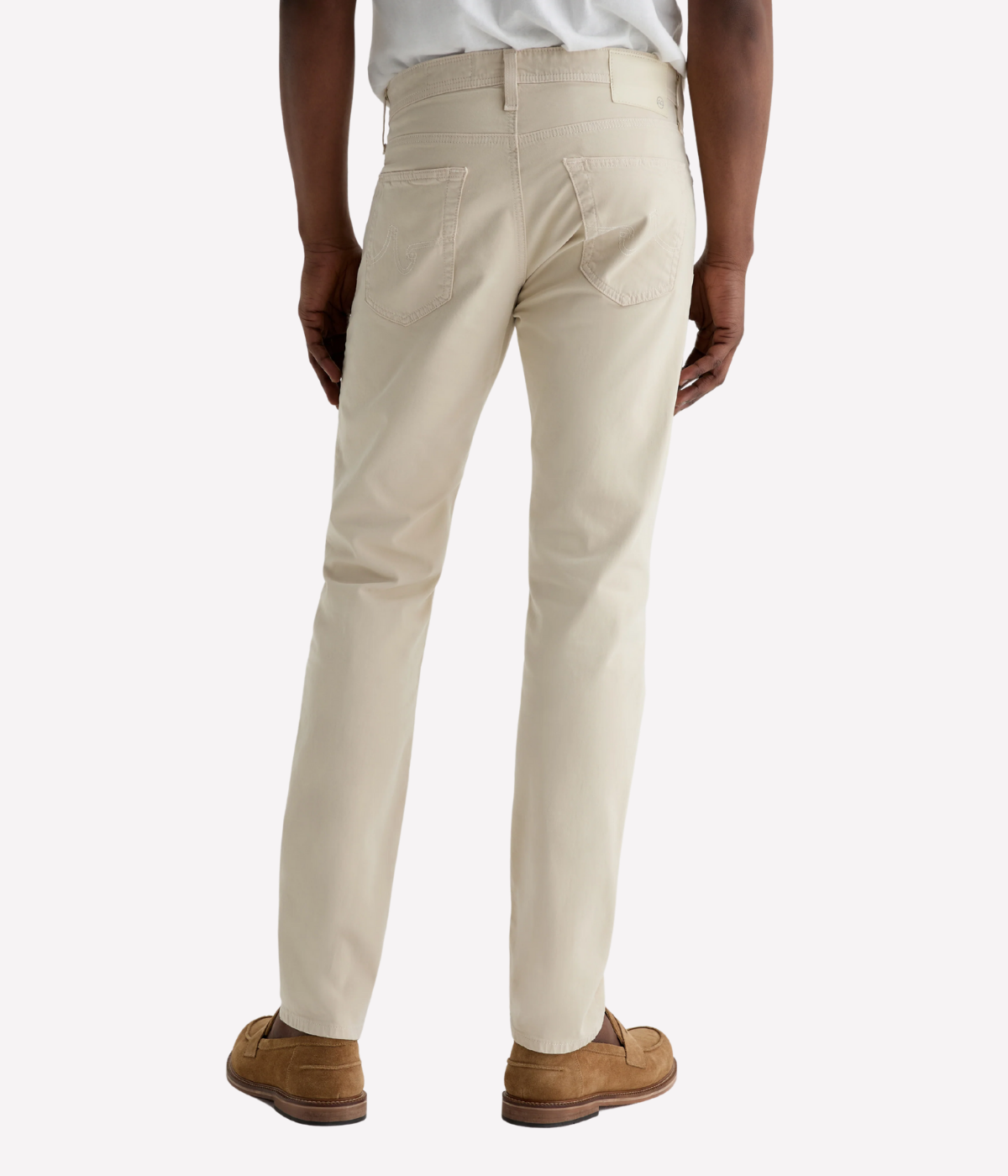 AG Tellis jeans in Natural Ivory, crafted from sueded stretch sateen with a slim fit, tapered leg, and soft brushed texture for elevated everyday wear.
