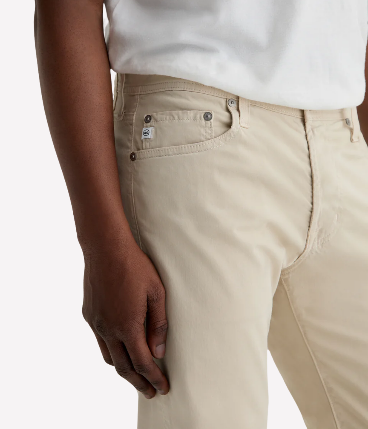 AG Tellis jeans in Natural Ivory, crafted from sueded stretch sateen with a slim fit, tapered leg, and soft brushed texture for elevated everyday wear.
