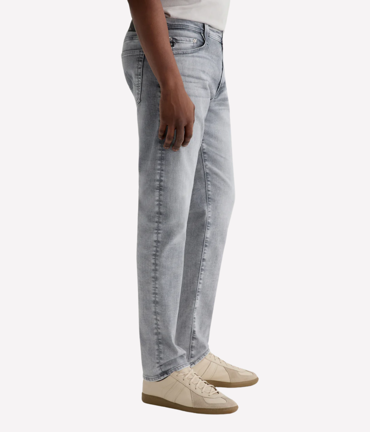 AG Tellis slim fit jeans in black Vapor Wash, made from stretch Italian denim with a tapered leg and sustainable finish.