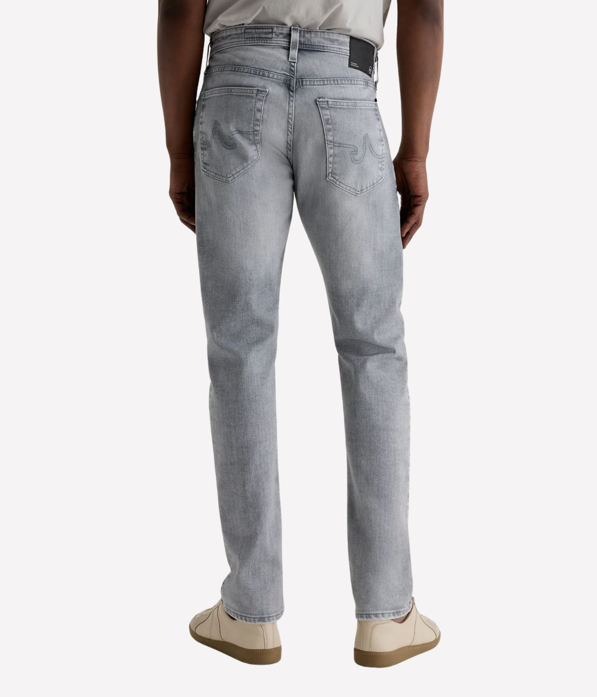 AG Tellis slim fit jeans in black Vapor Wash, made from stretch Italian denim with a tapered leg and sustainable finish.