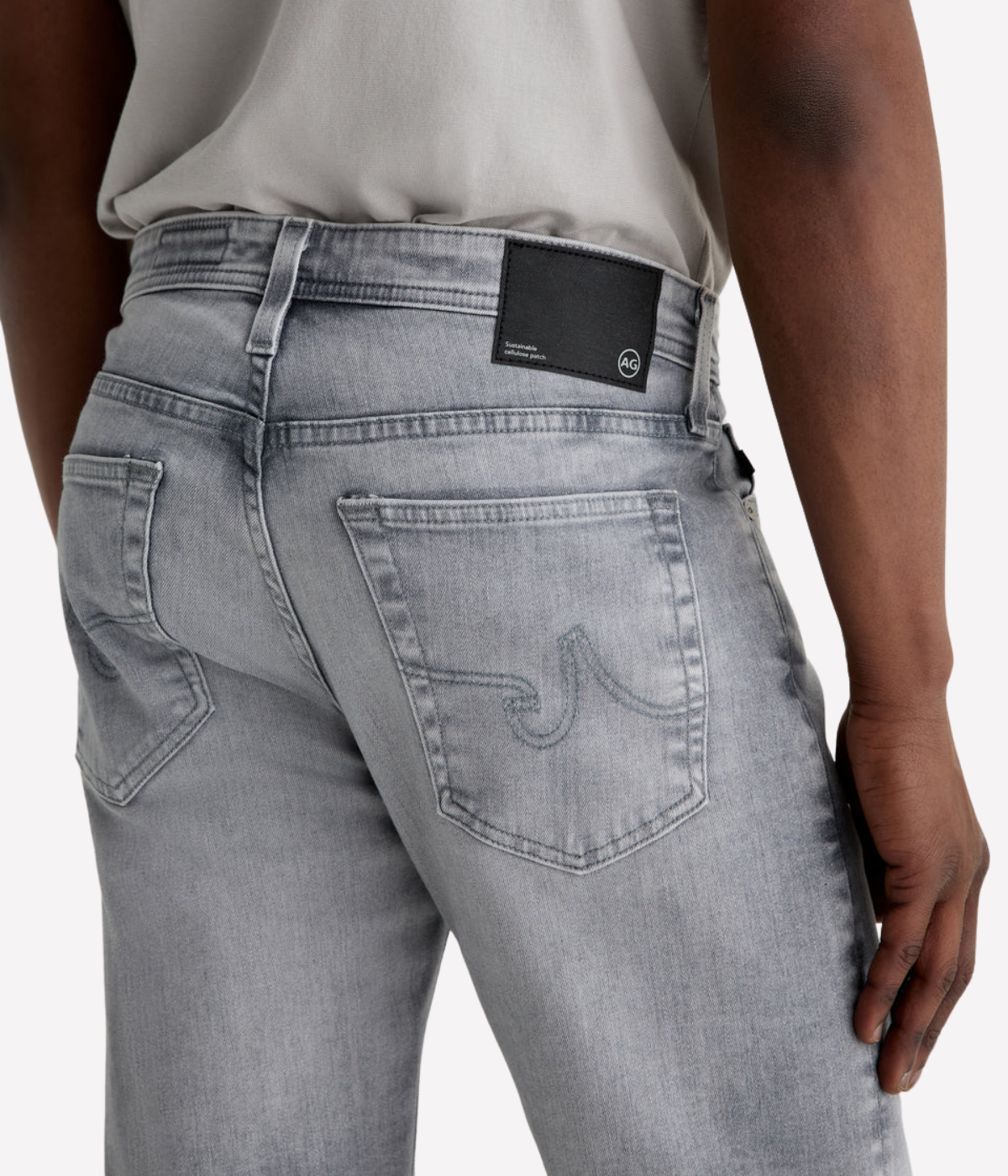 AG Tellis slim fit jeans in black Vapor Wash, made from stretch Italian denim with a tapered leg and sustainable finish.