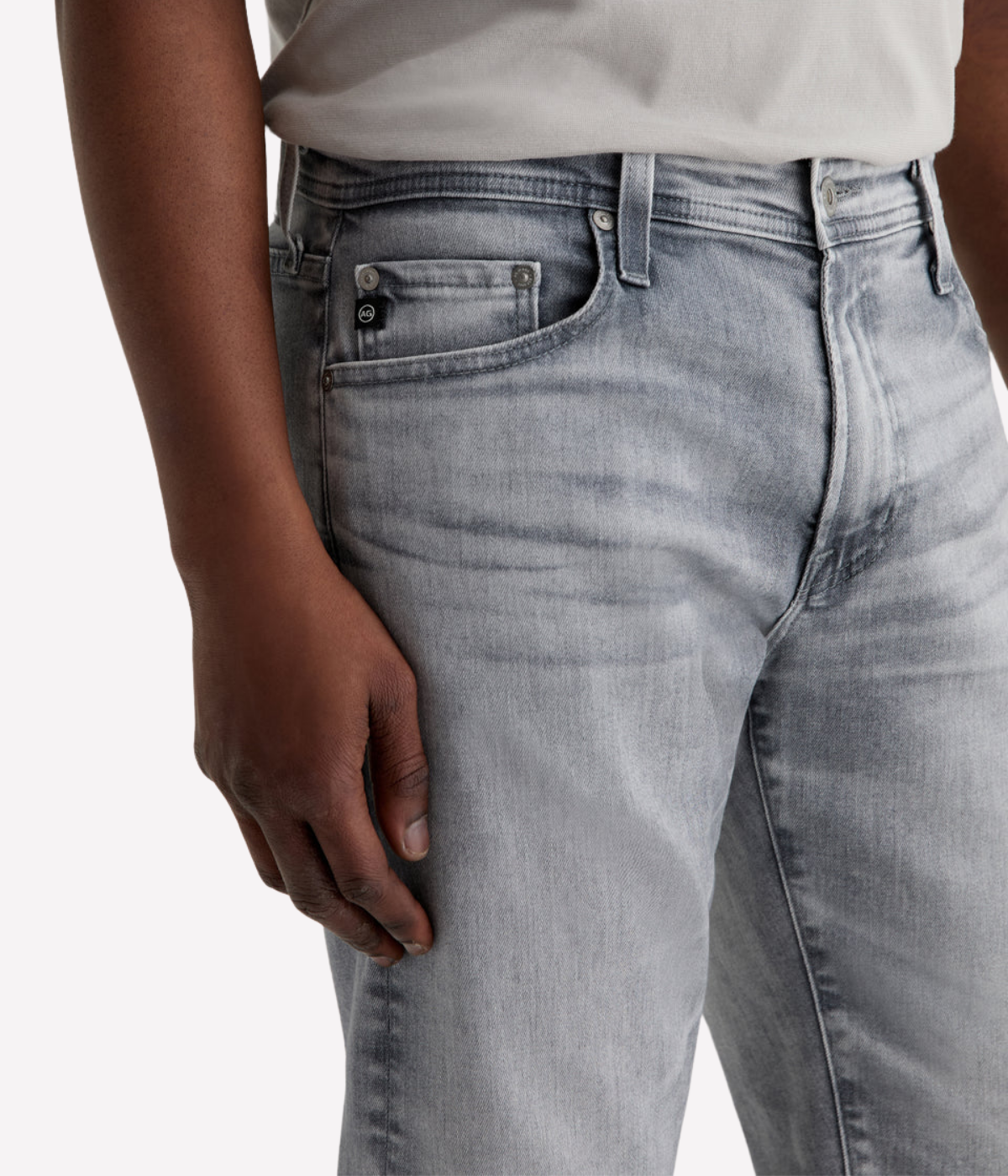 AG Tellis slim fit jeans in black Vapor Wash, made from stretch Italian denim with a tapered leg and sustainable finish.