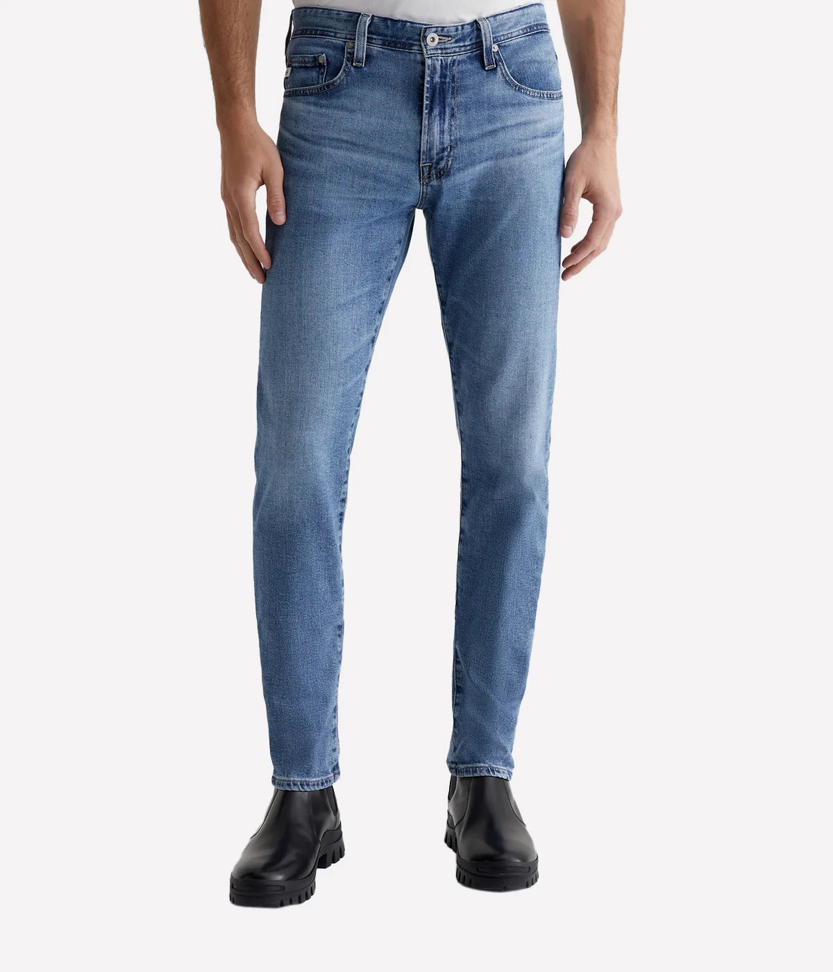 Men’s light blue slim jeans with fading, whiskering, and indigo seam variations.
