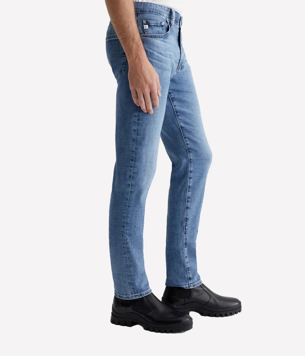 Men’s light blue slim jeans with fading, whiskering, and indigo seam variations.