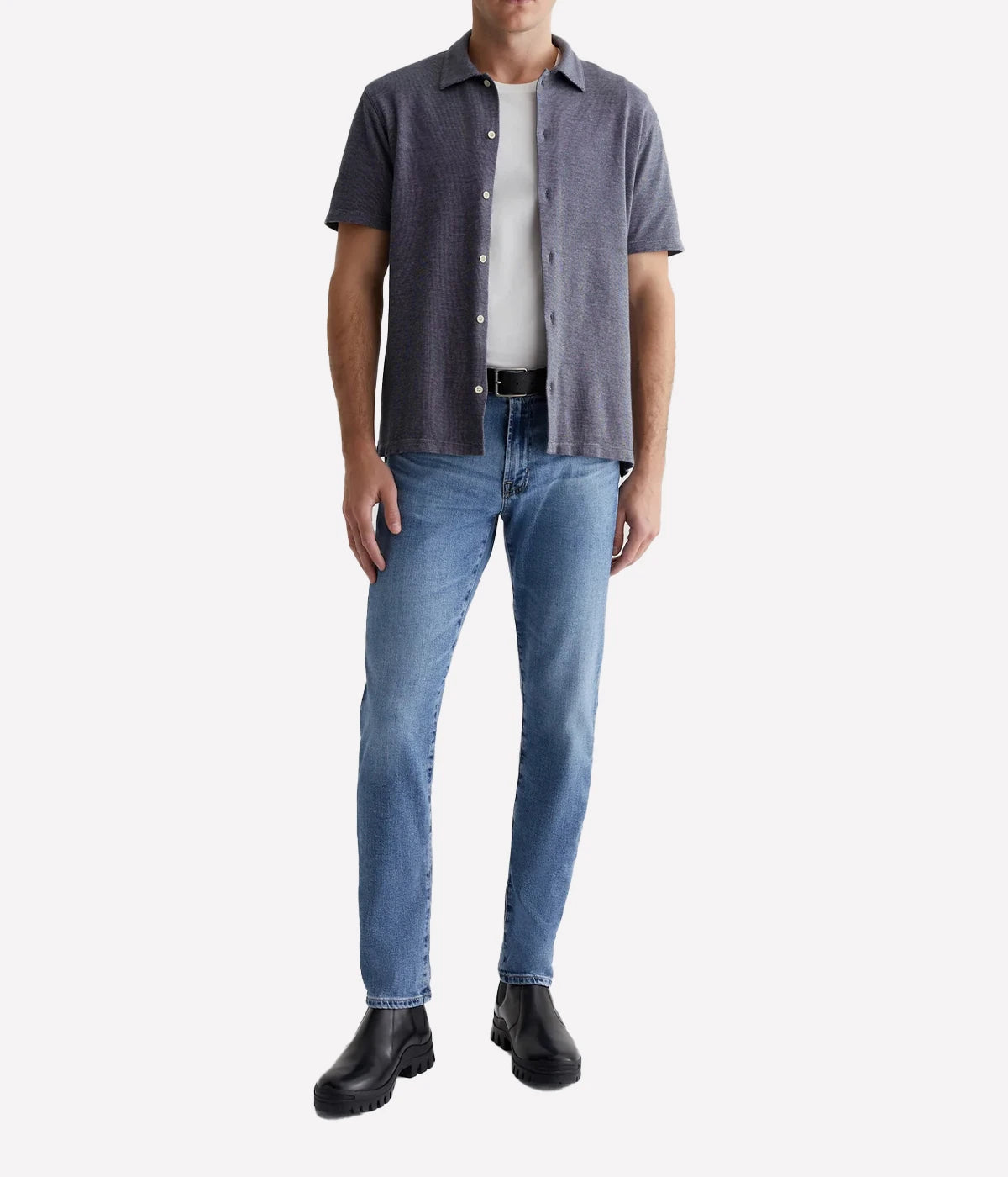 Men’s light blue slim jeans with fading, whiskering, and indigo seam variations.