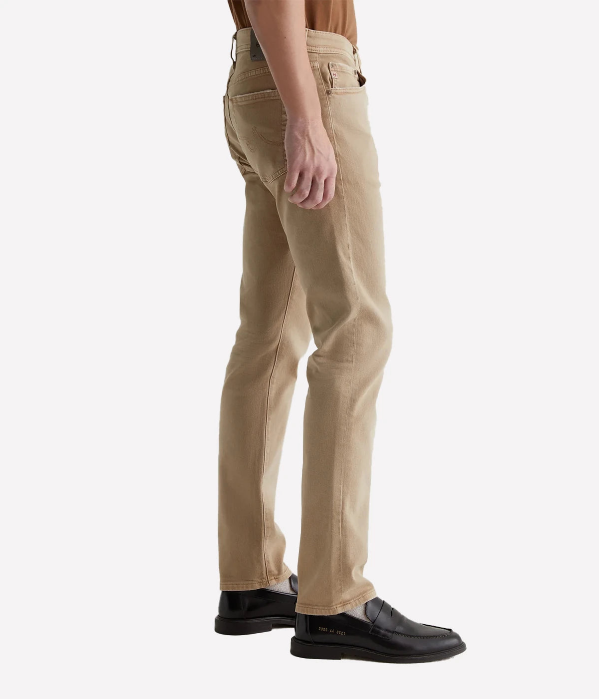 Sulfur-dyed khaki slim jeans for men, featuring a 7-year fade effect. Designed with a fitted upper block and tapered leg openings in 8.7 oz. Hyper Soft Bull Denim. The velvety fabric, part of the AG Cloud Soft Denim™ collection, offers dual-elastic stretch and a supple feel that softens with wear.