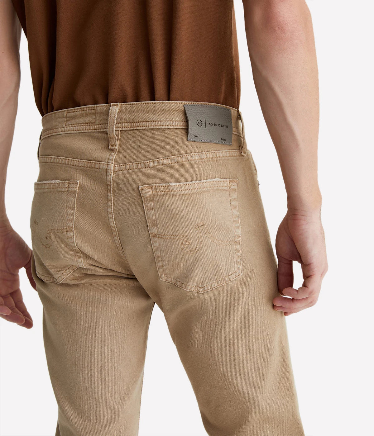 Sulfur-dyed khaki slim jeans for men, featuring a 7-year fade effect. Designed with a fitted upper block and tapered leg openings in 8.7 oz. Hyper Soft Bull Denim. The velvety fabric, part of the AG Cloud Soft Denim™ collection, offers dual-elastic stretch and a supple feel that softens with wear.