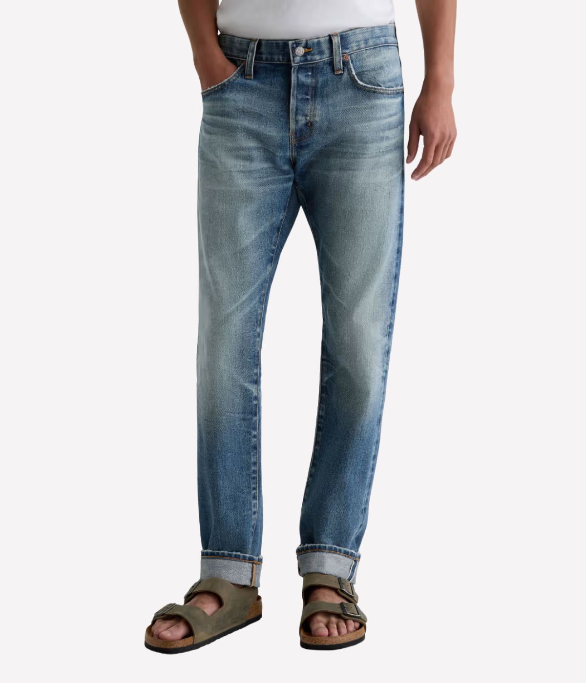 Men’s AG Tellis jeans in 14-year faded blue AG-ed™ wash, crafted from Japanese stretch selvage denim with a modern slim fit and tapered leg.