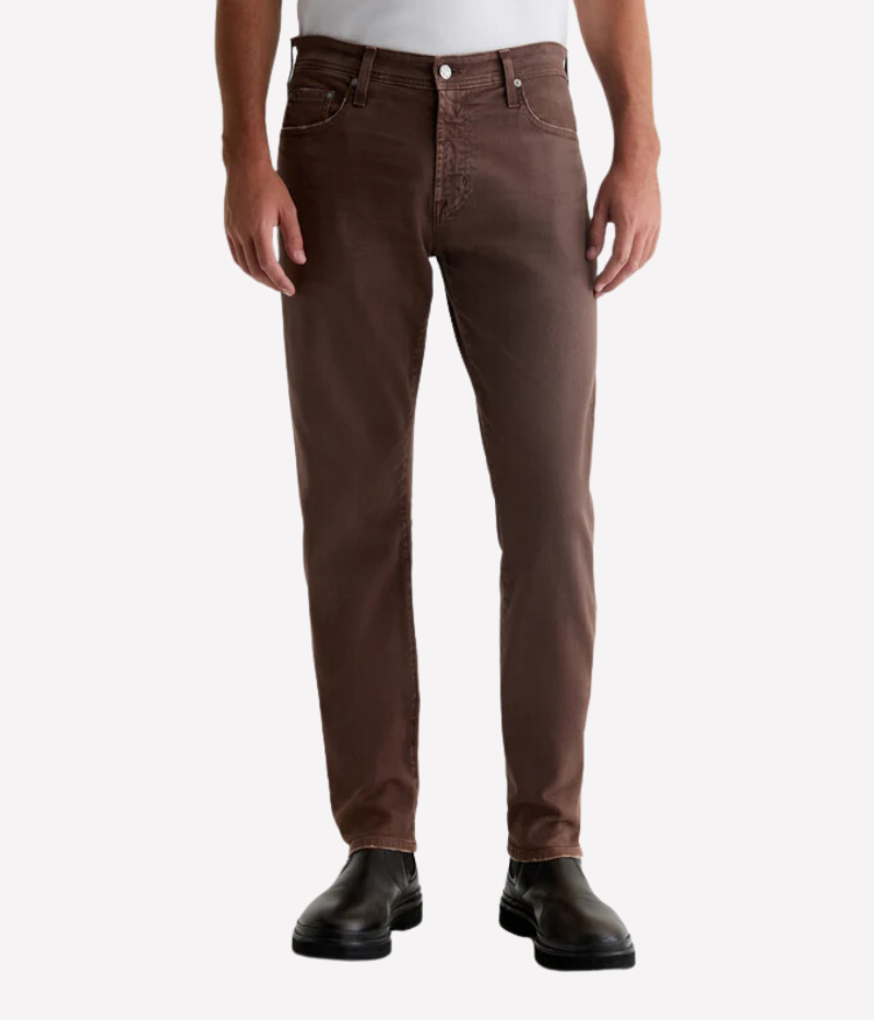 AG Tellis Slim Fit jeans in 7 Years Sulfur Berry Brown, featuring a rich, sulphur-dyed brown shade with an AG-ed™ finish that mimics seven years of wear. Designed with a fitted upper block and mid-rise waist, offering a slim, tapered leg that hits at the ankle.