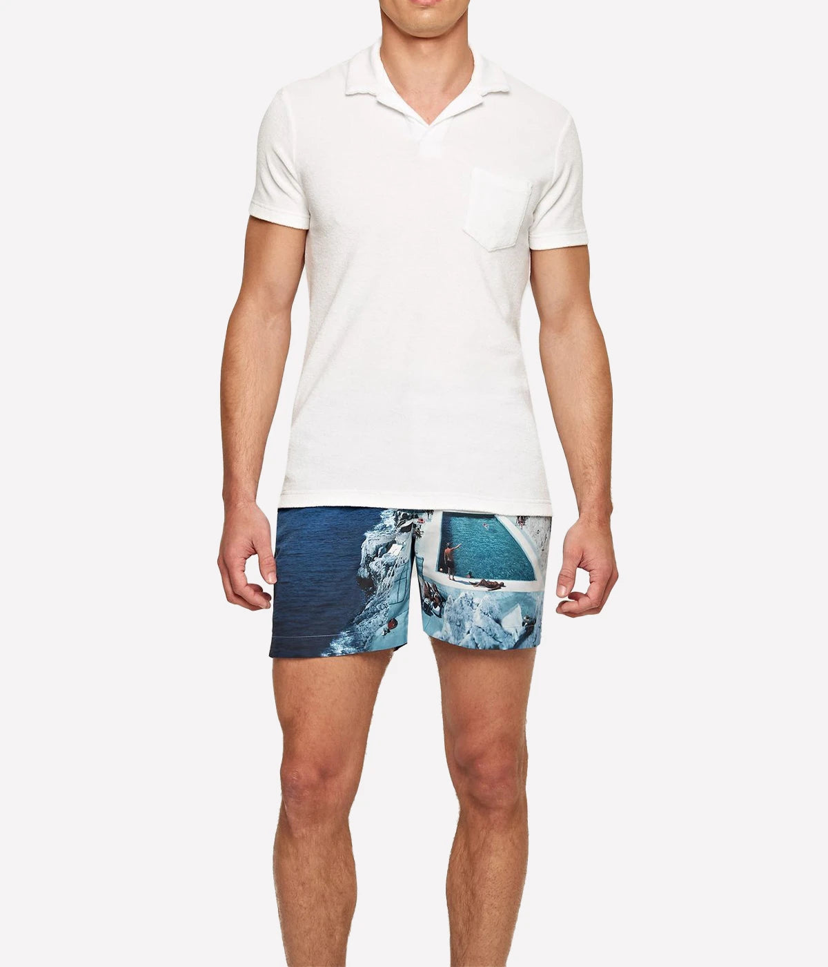 White terry towelling polo by Orlebar Brown, featuring a soft and breezy fabric with a stylish open placket. The tailored fit ensures comfort without being too snug, making it the perfect casual yet polished piece. Pair it with Orlebar Brown swim shorts for a complete holiday look. Made from 100% terry towelling cotton.