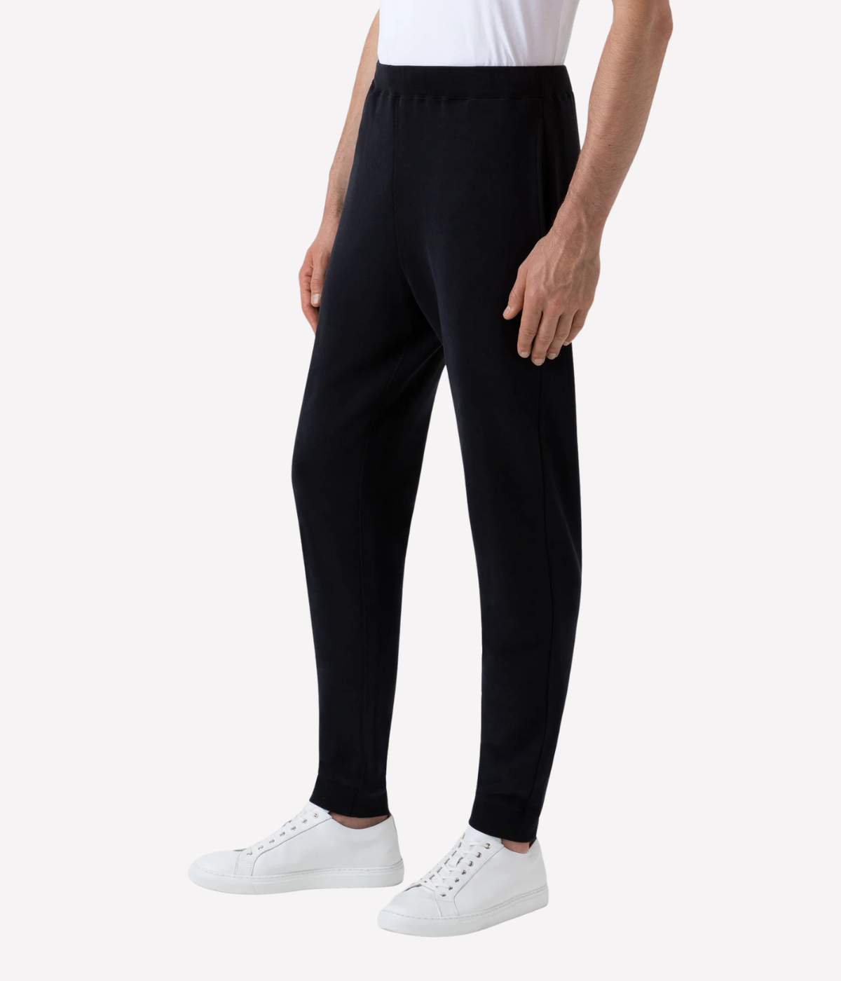 Men’s slim fit track pants in black, crafted from loopback cotton with ribbed waistband and tapered leg—part of a matching track set.