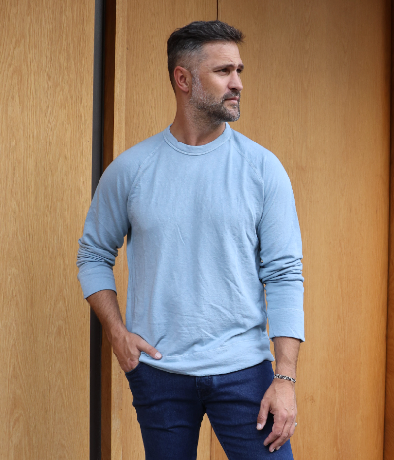 James Perse Vintage French Terry Sweatshirt in lightweight Supima cotton terry, featuring a crew neckline, full-length raglan sleeves, and a relaxed fit. Garment-dyed for a soft, lived-in feel, with self-fabric cuffs and hem for a clean, minimal look.