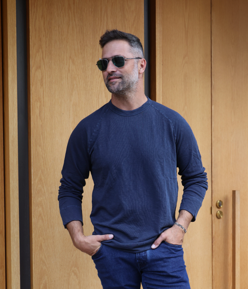 Close-up of James Perse Vintage French Terry Sweatshirt in navy blue, showing soft cotton texture, crew neckline, raglan sleeves, and relaxed fit.