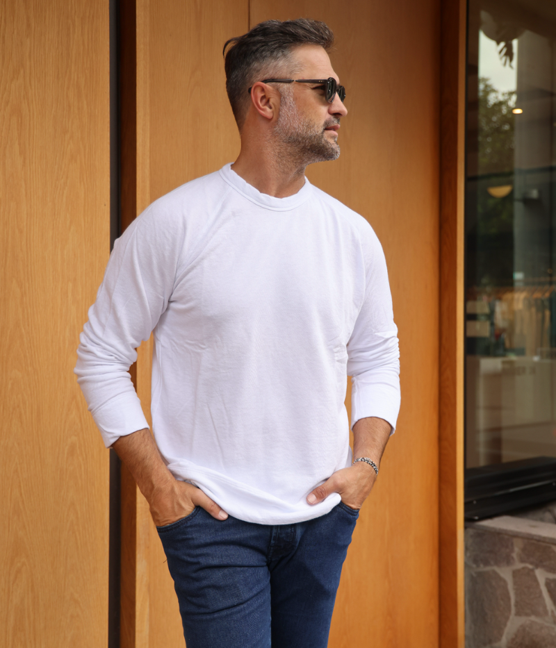 James Perse Vintage French Terry Sweatshirt in lightweight Supima cotton terry, featuring a crew neckline, full-length raglan sleeves, and a relaxed fit. Garment-dyed for a soft, lived-in feel, with self-fabric cuffs and hem for a clean, minimal look.