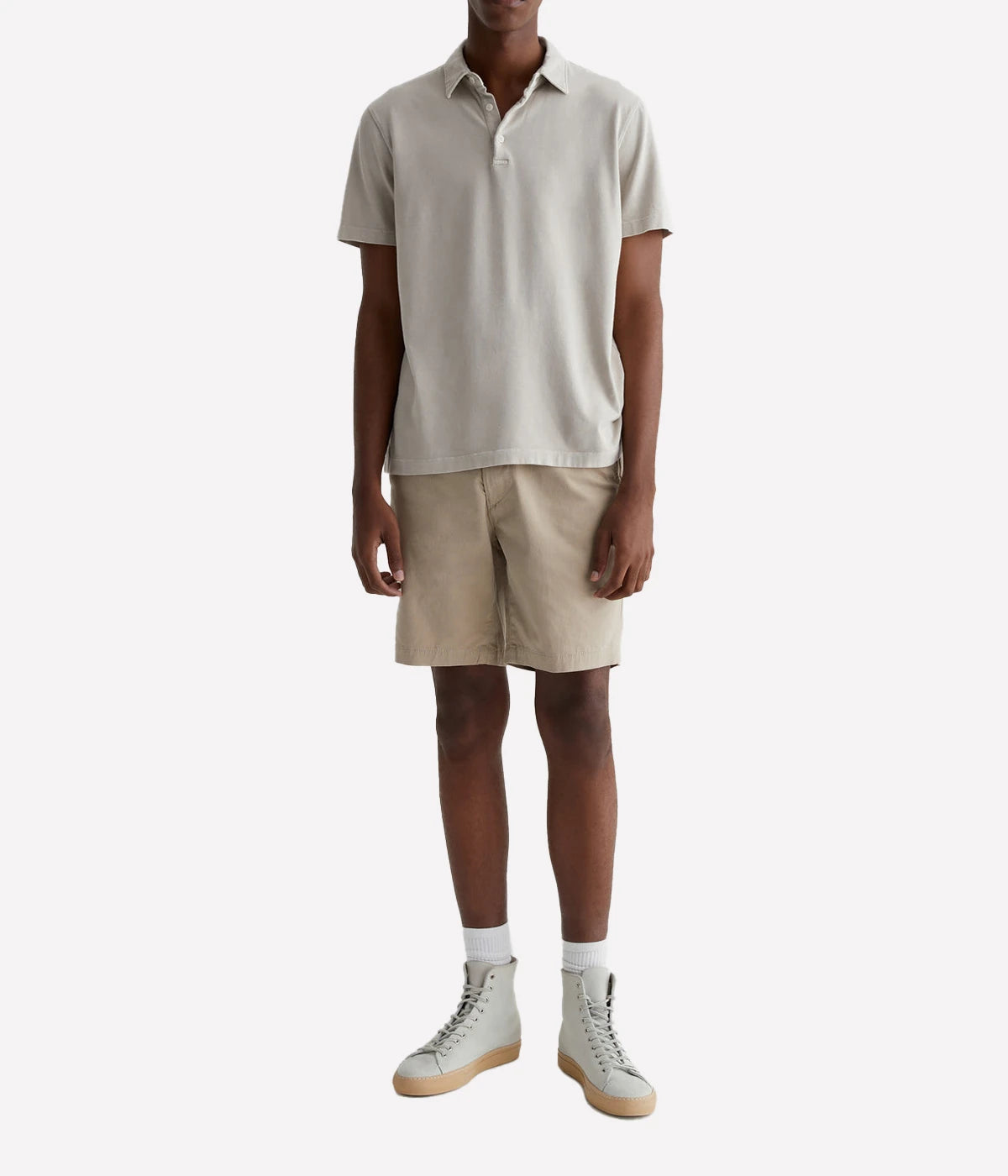 AG Wanderer Shorts styled with a short-sleeve polo shirt and sneakers, showcasing a relaxed yet polished outfit for versatile, warm-weather wear.