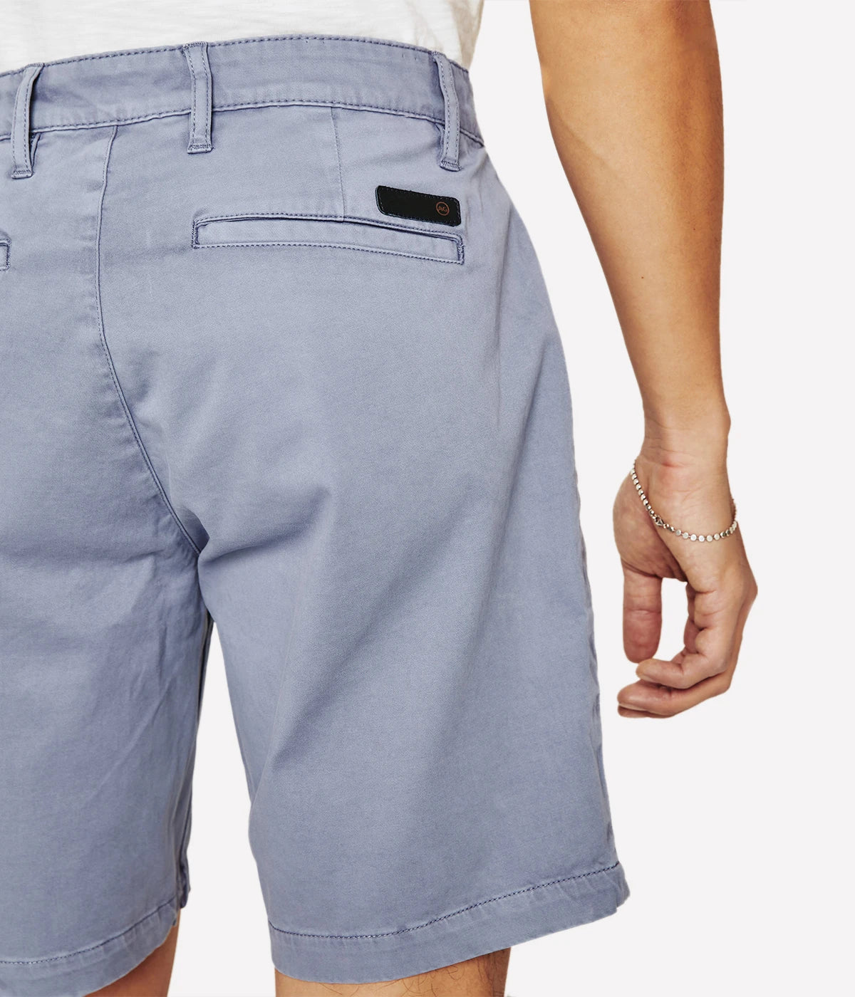 Close-up of the AG Wanderer Shorts, showing fine stitching, tailored pocket detailing, and smooth cotton fabric texture.