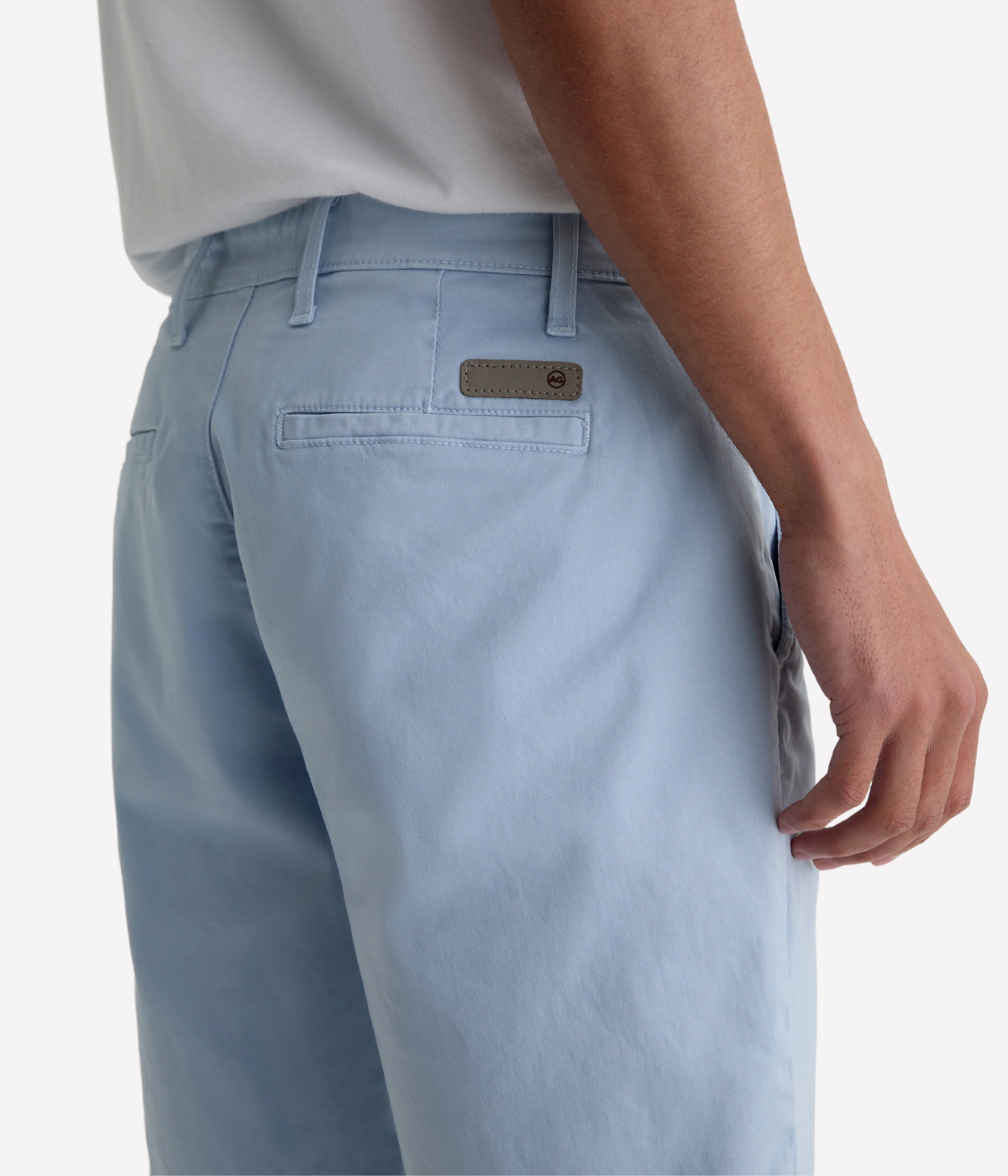 AG Wanderer Shorts in light blue with a slim fit, tapered leg opening, and ultra-lightweight cotton-blend fabric, made in the USA.