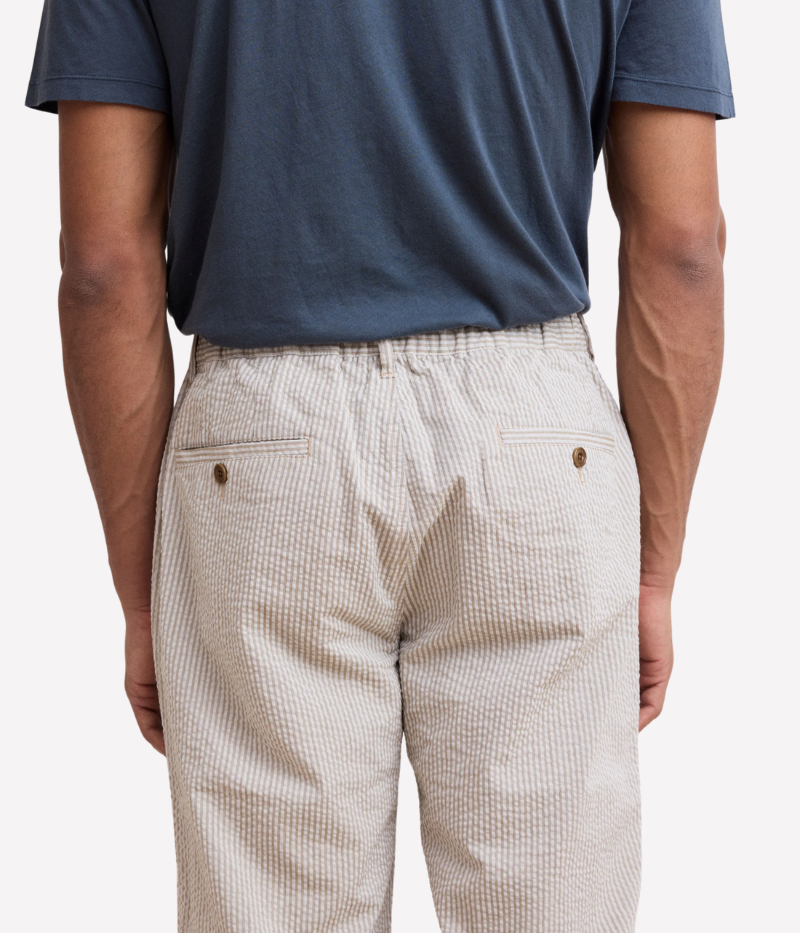 Tanker seersucker pants – straight-leg, elastic waistband with drawstring, and textured fabric. Pair with matching blazer for an effortless summer suit.