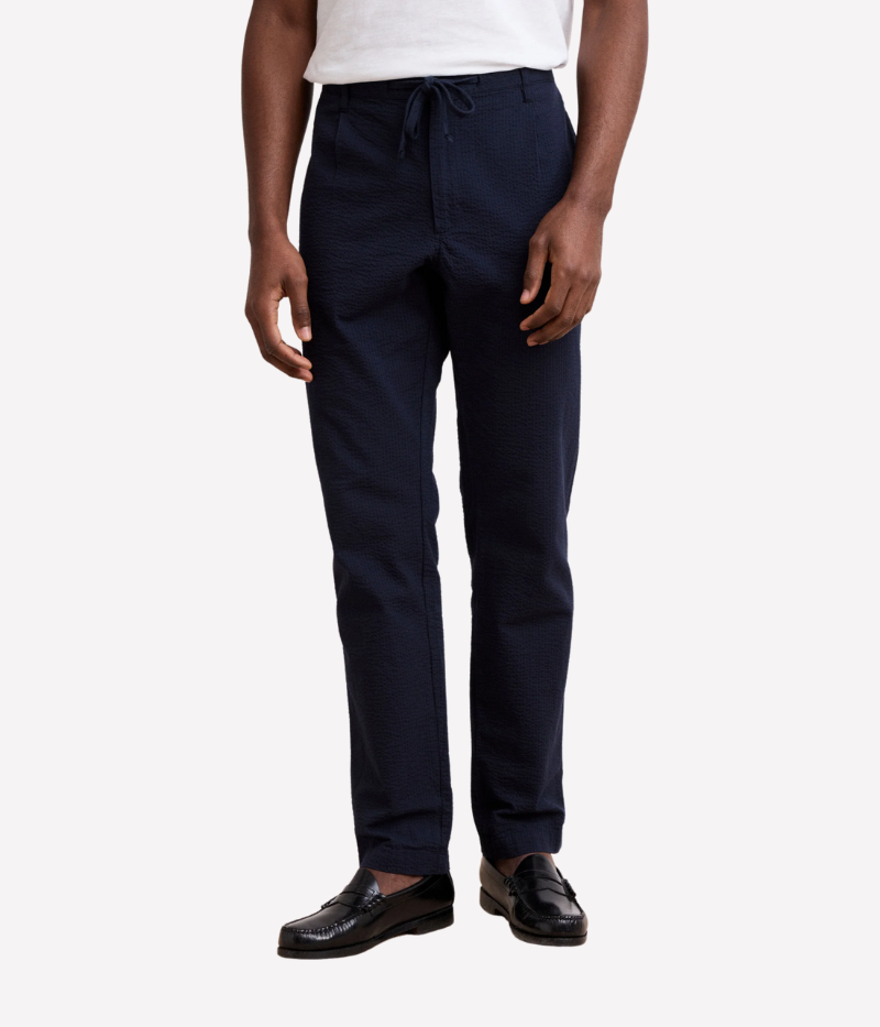 Tanker seersucker pants – straight-leg, elastic waistband with drawstring, and textured fabric. Pair with matching blazer for an effortless summer suit.