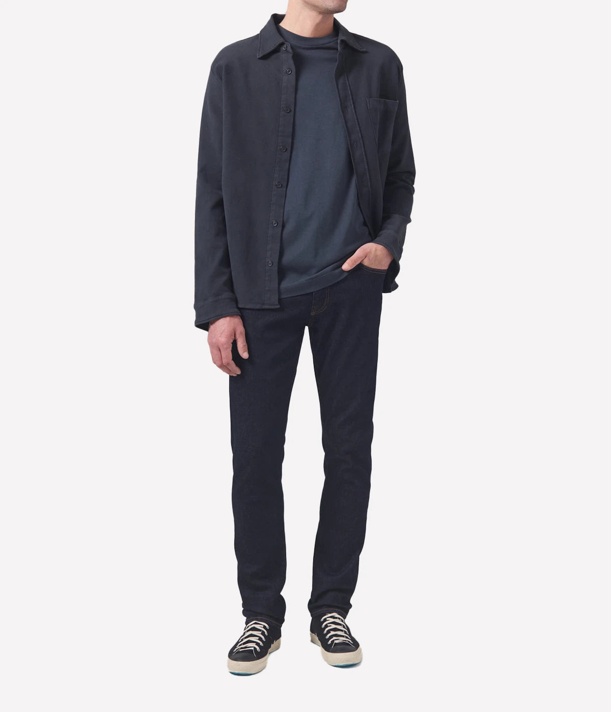 Adler Jean, featuring a low-rise waist and tapered leg design. Inspired by the city’s rock scene, this minimalist jean is crafted from a blend of lyocell, organic cotton, modal, polyester, and elastane for a comfortable and flexible fit, free from unnecessary embellishments.