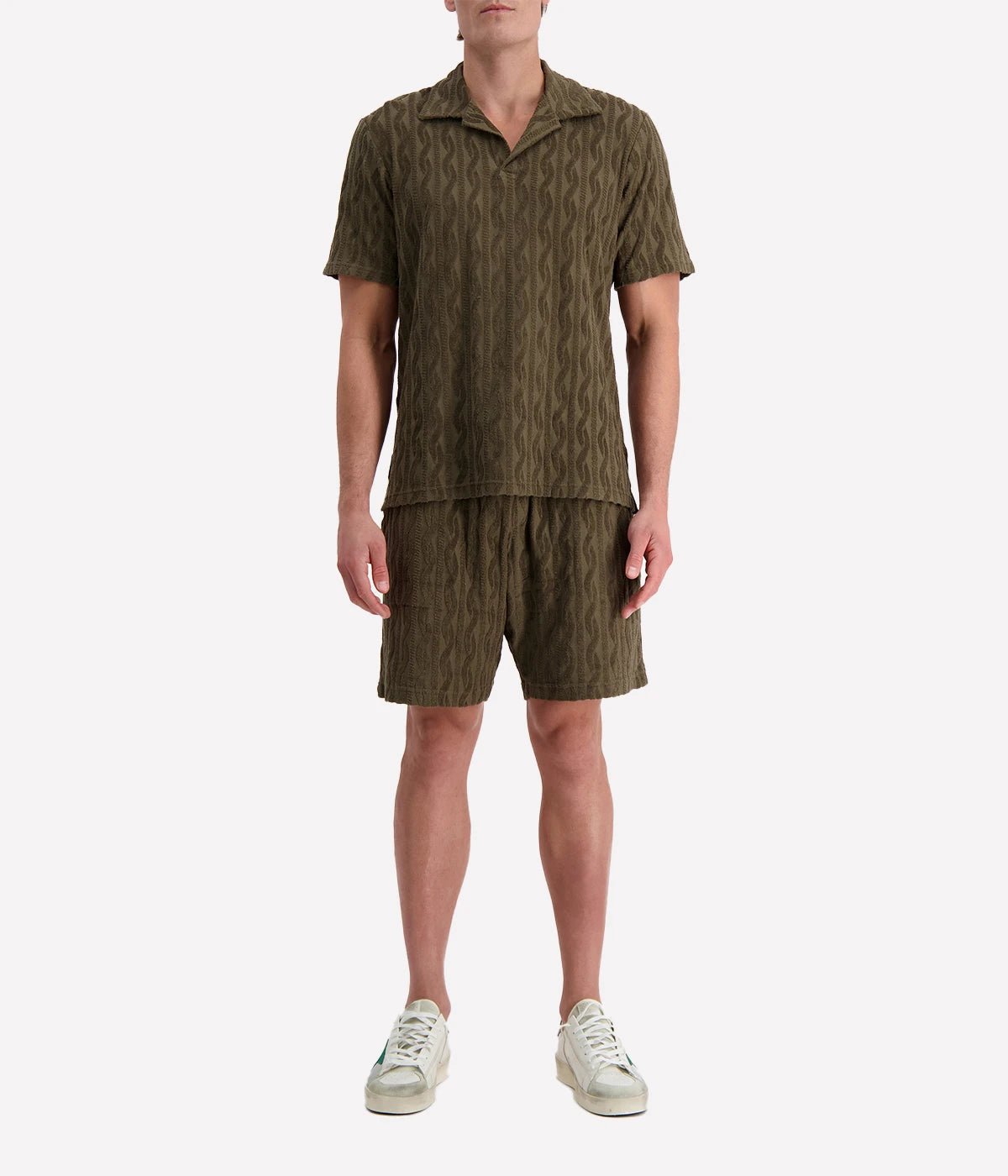 Men's Faustino Polo in organic Terry cotton with jacquard pattern, featuring an open camp collar, relaxed fit, and side slits.