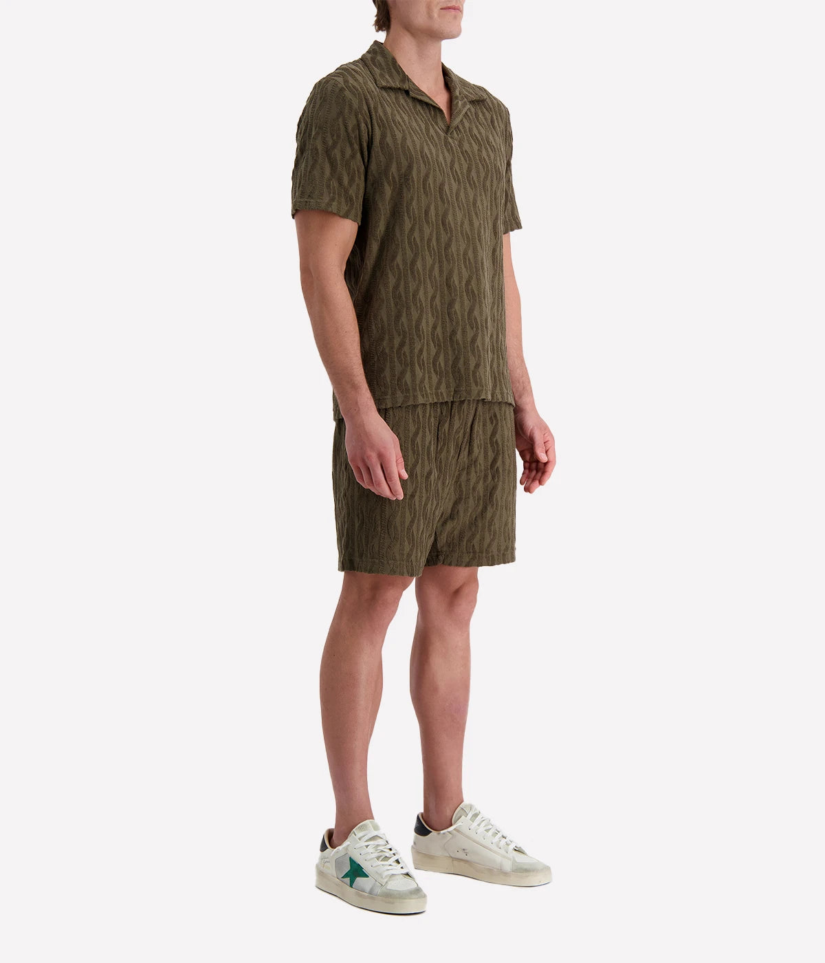 Men's Faustino Polo in organic Terry cotton with jacquard pattern, featuring an open camp collar, relaxed fit, and side slits.