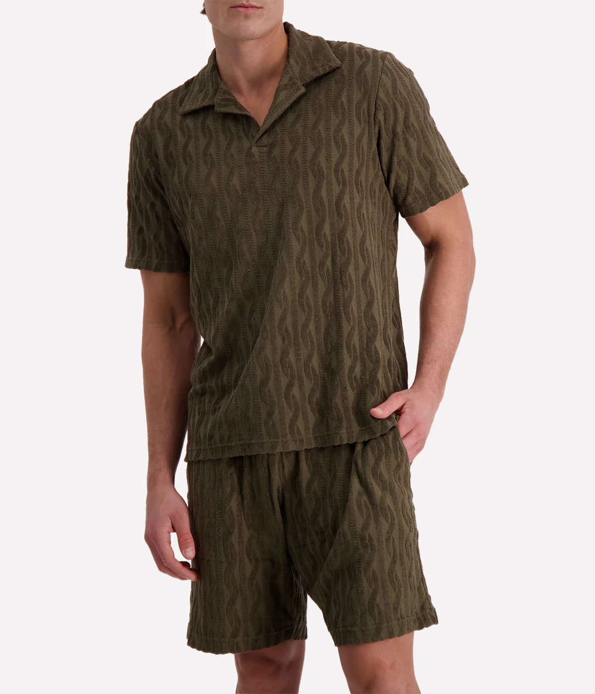 Men's Faustino Polo in organic Terry cotton with jacquard pattern, featuring an open camp collar, relaxed fit, and side slits.